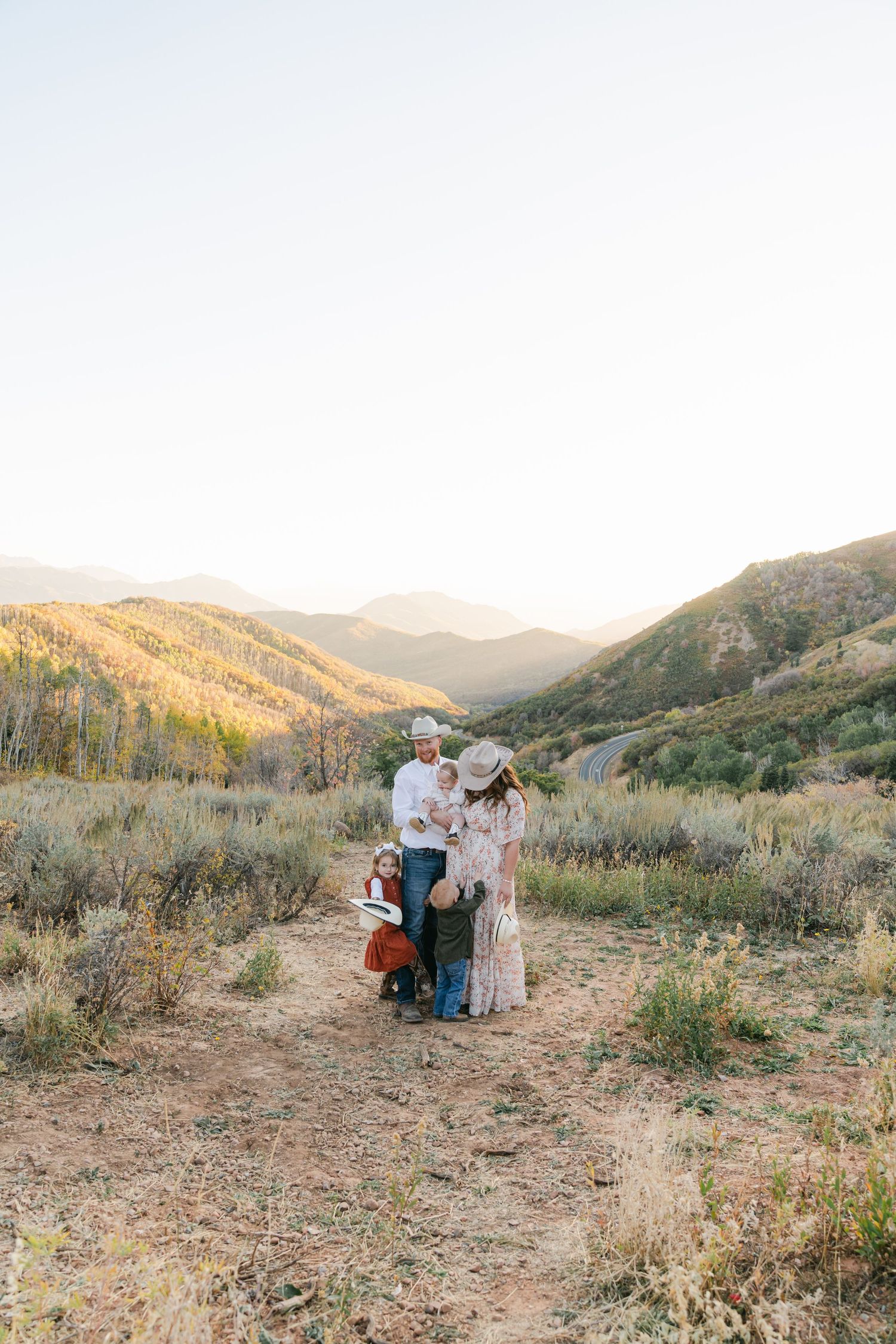Family of five enjoying a fall mountain session in Northern Utah, captured with warm tones and timeless, true-to-color photography.