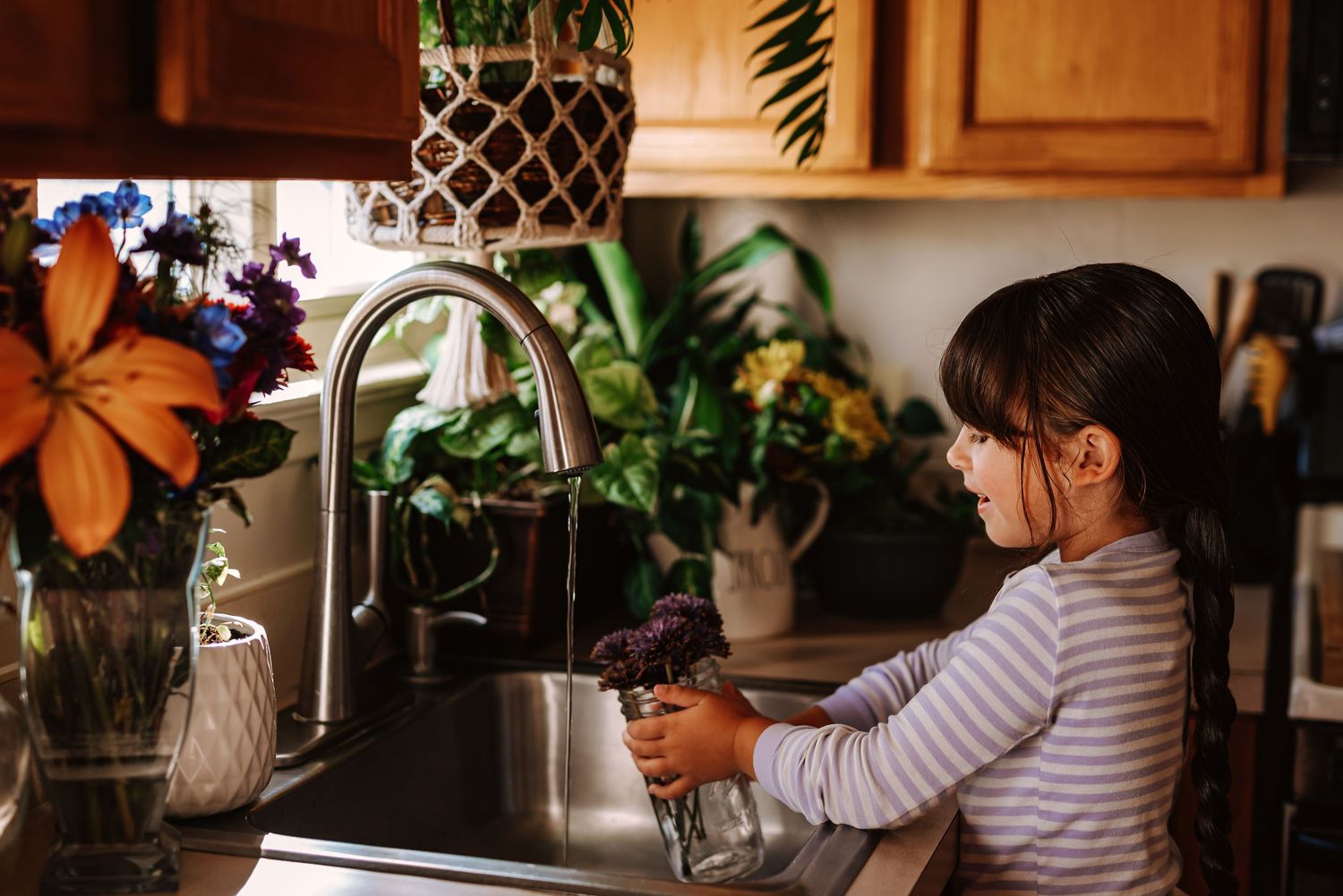 A series of connected images showing someone preparing coffee using a pour-over method in a cozy kitchen setting.