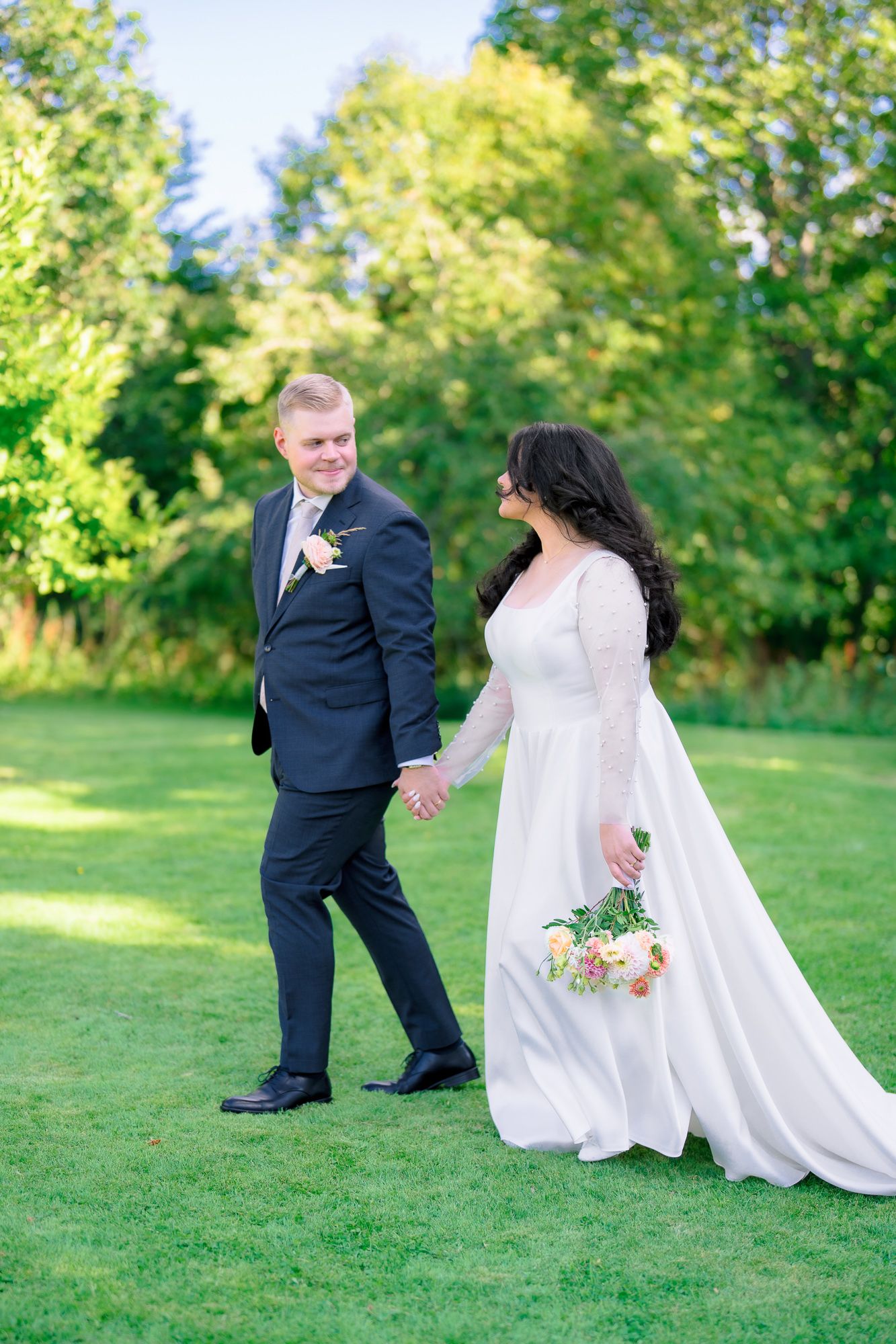 Couple in wedding attire playfully poses on green lawn in series of candid romantic shots.