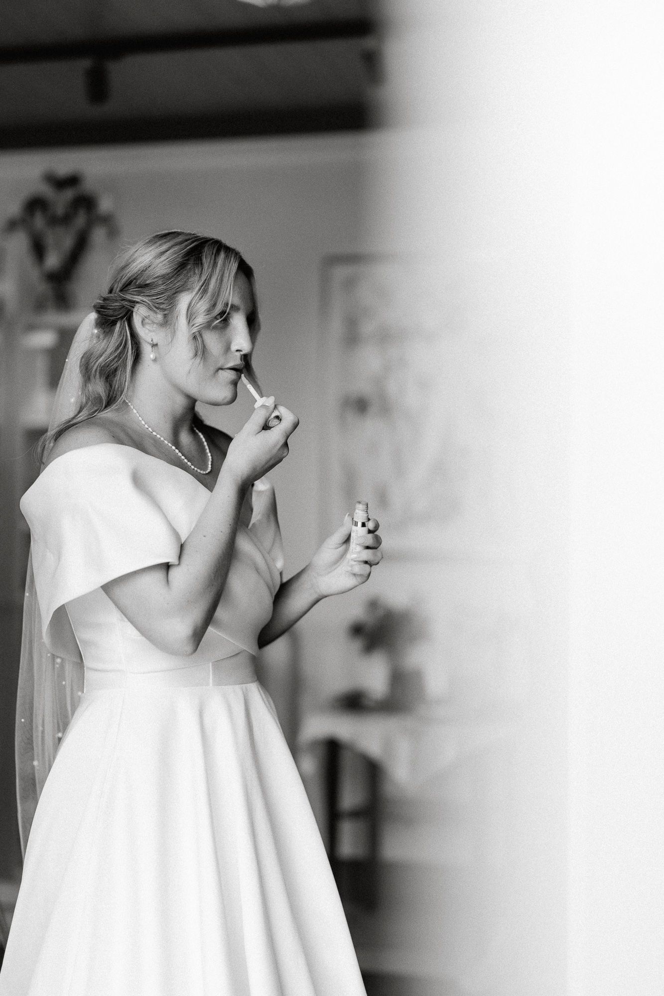 Black and white photo series showing emotional reactions of someone in a white dress during a special moment.