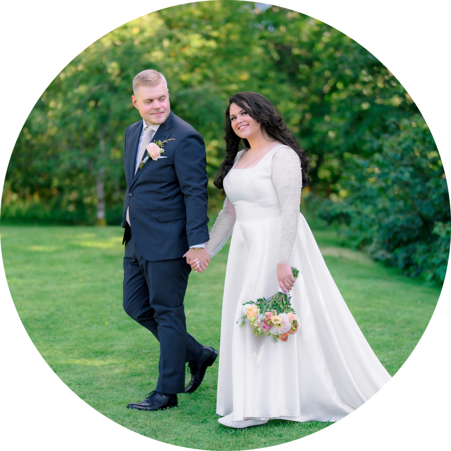 A bride and groom share romantic moments in a lush green garden setting during their outdoor wedding photoshoot.