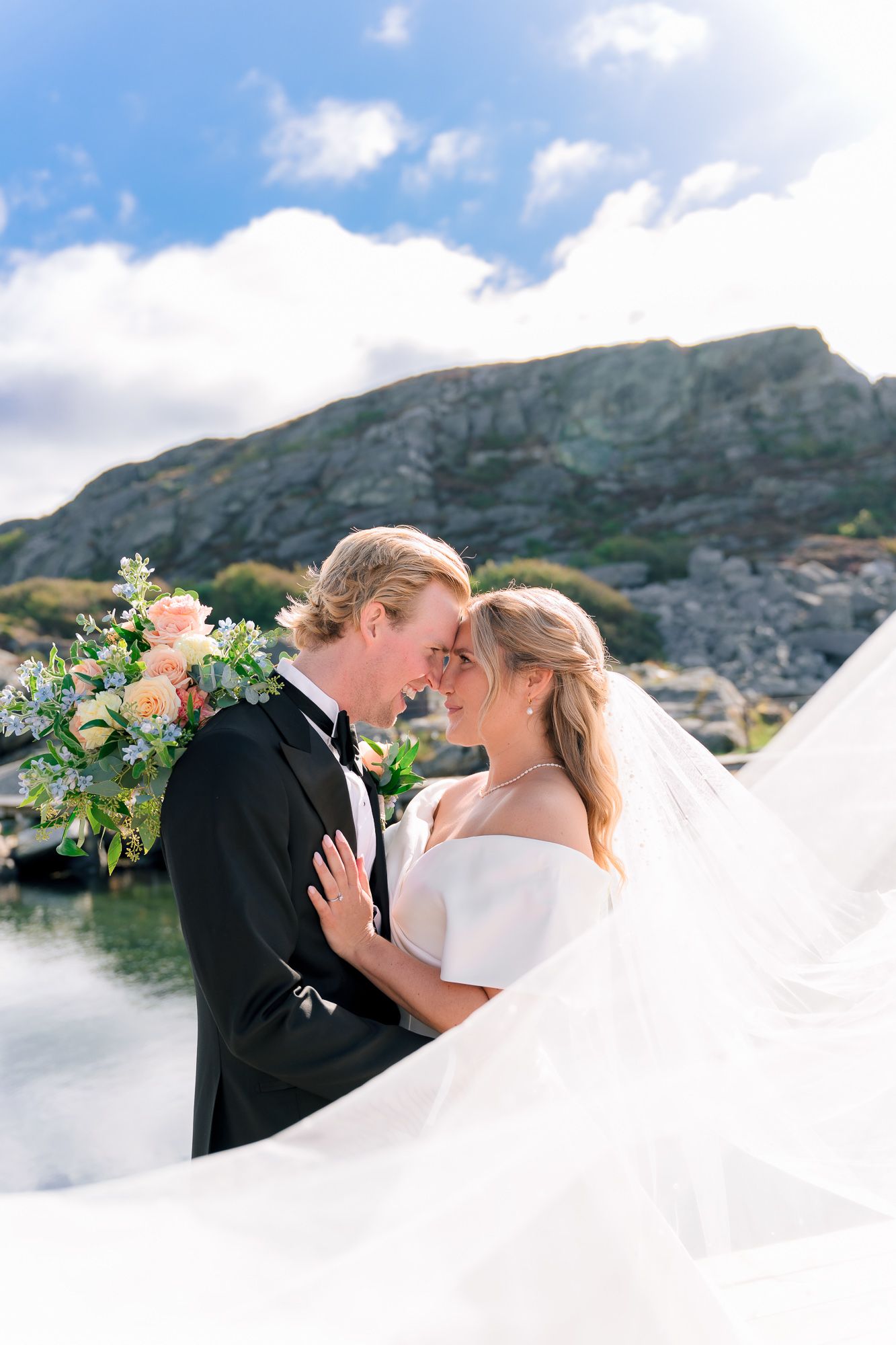 A romantic wedding couple shares intimate moments against a stunning mountain backdrop in a series of dreamy photographs.
