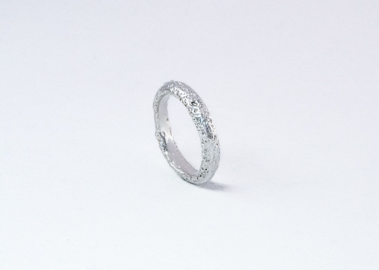 A sparkling diamond eternity band ring with multiple stones set in white gold or platinum metal.