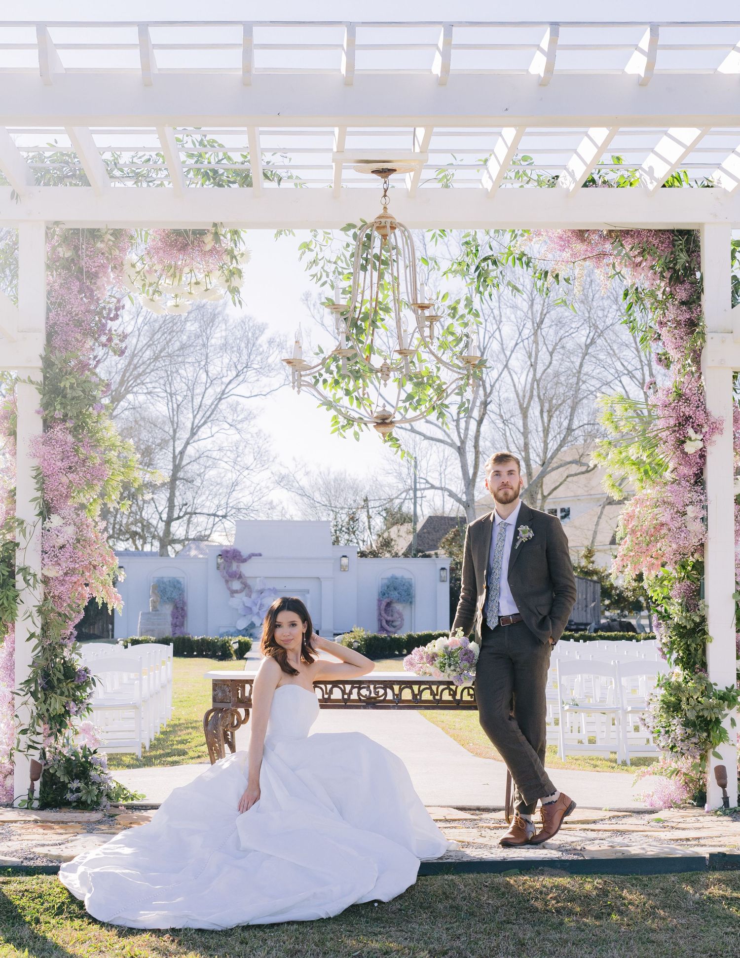 Playful wedding sequence showing bride twirling in white gown under garden pergola.