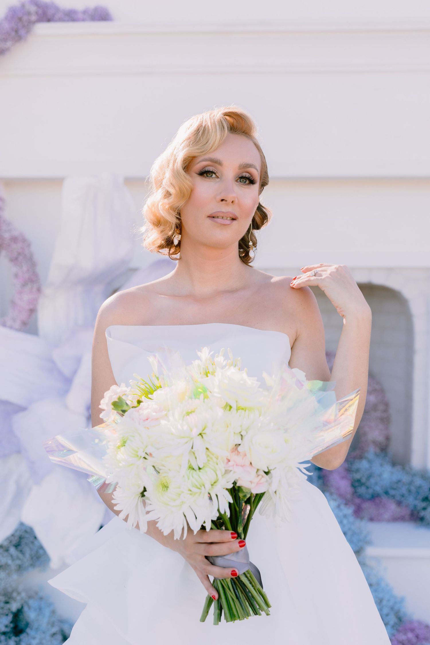 Elegant bridal portrait with white peony bouquet and classic styling.