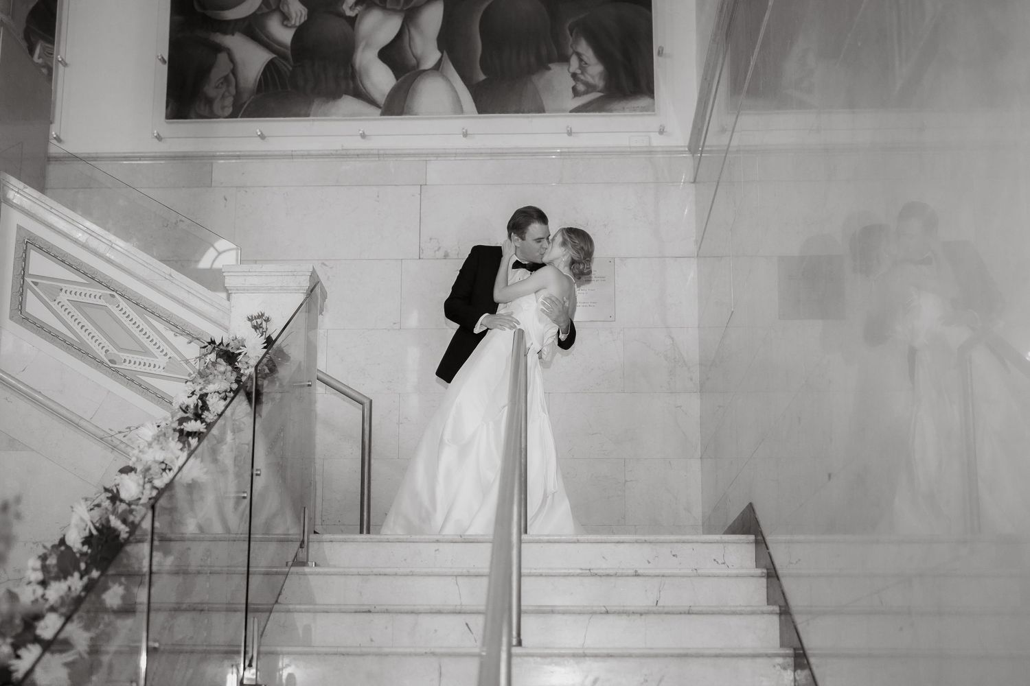 Romantic black and white wedding photos on elegant marble steps.