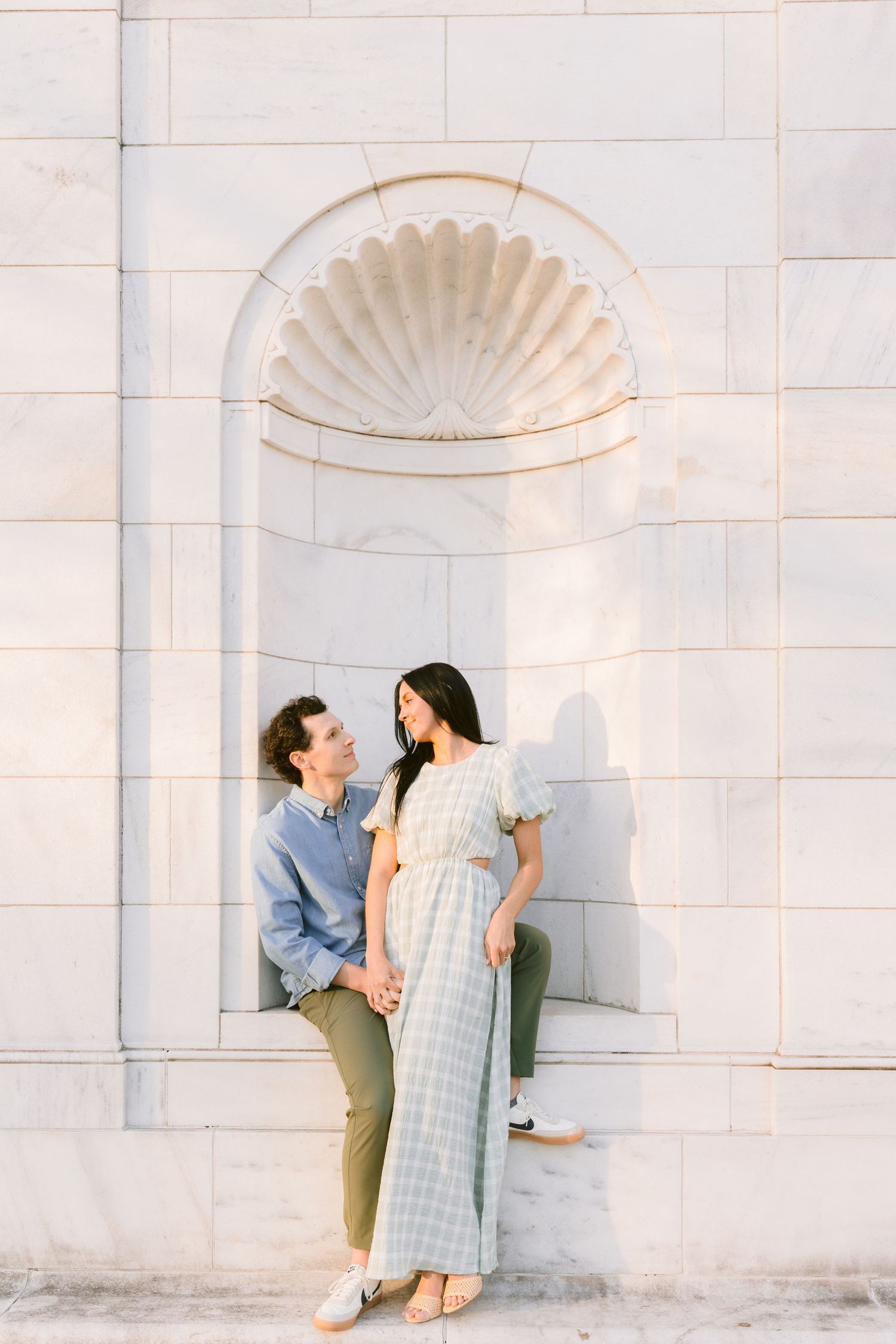 Romance sparks against white architectural details as couple shares intimate moments in three matching styled photos.