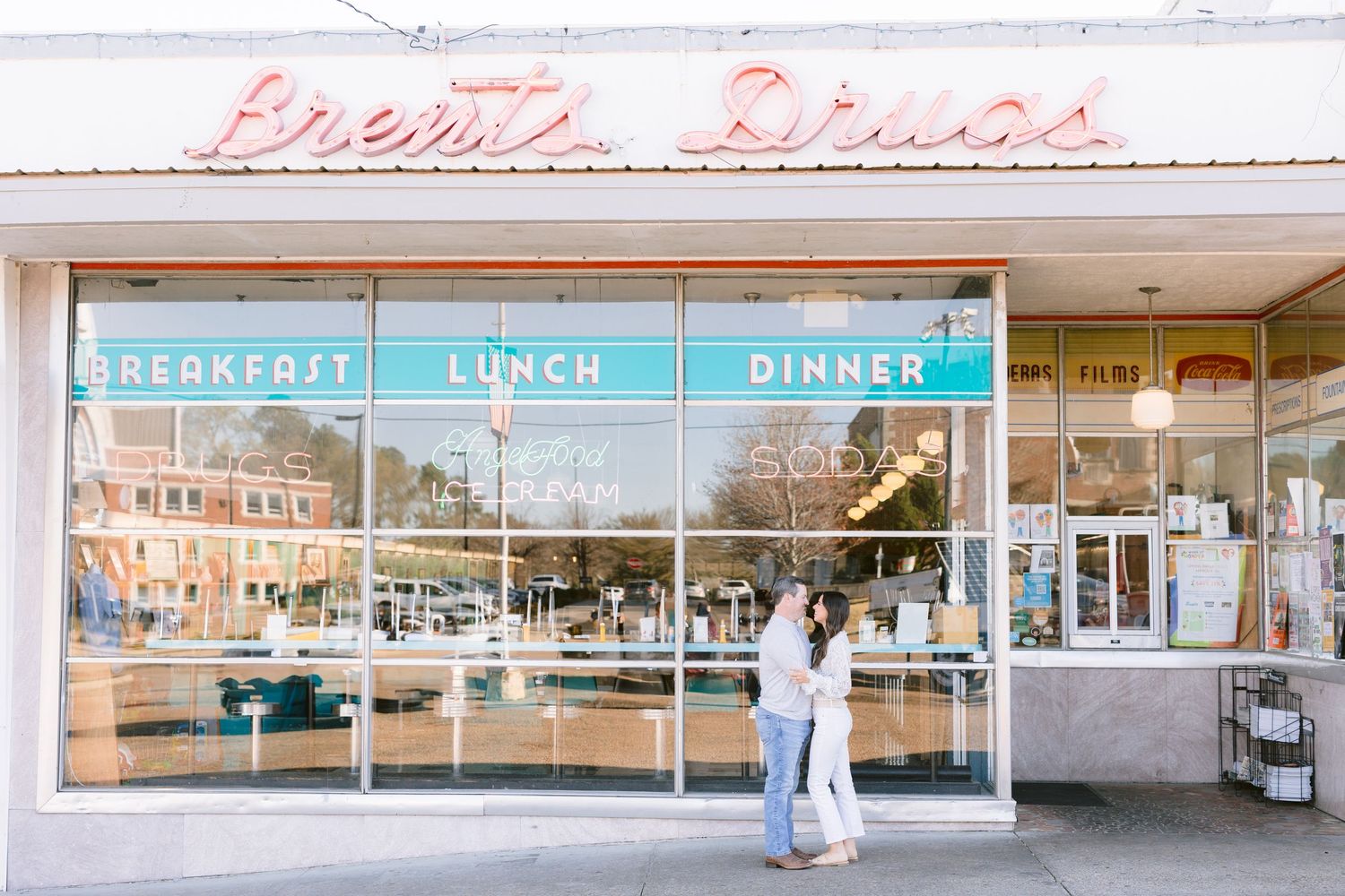 Retro diner storefront with vintage signage and large windows displaying 'breakfast lunch dinner' text.