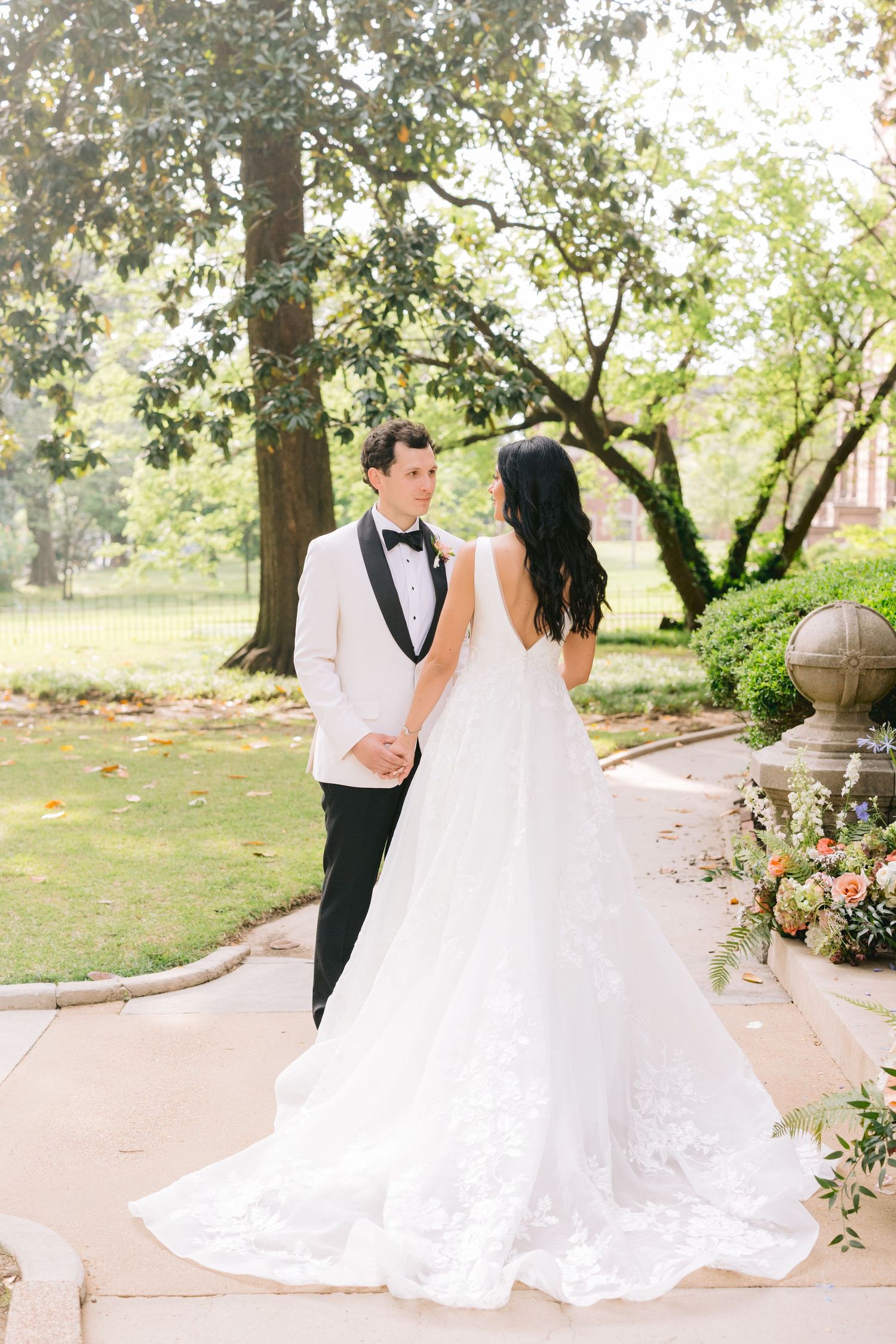 A sequence of romantic wedding photos showing a couple walking together in a garden setting with flowing white dress details.