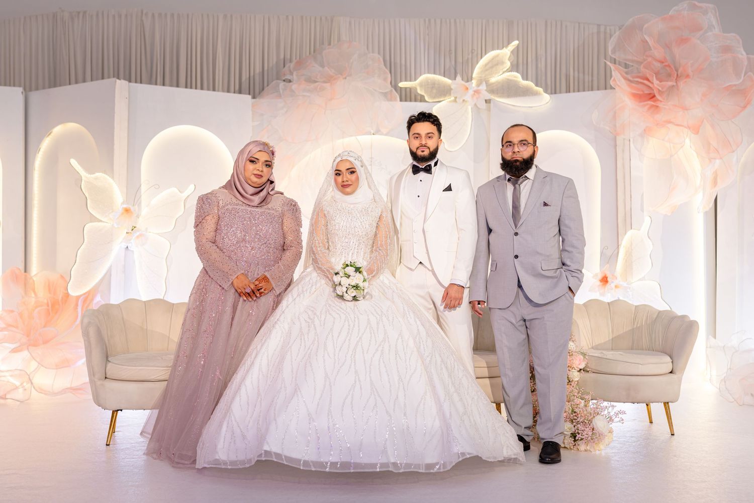 A wedding celebration with white decor and multiple scenes showing a bride in a white gown and wedding party in formal attire.