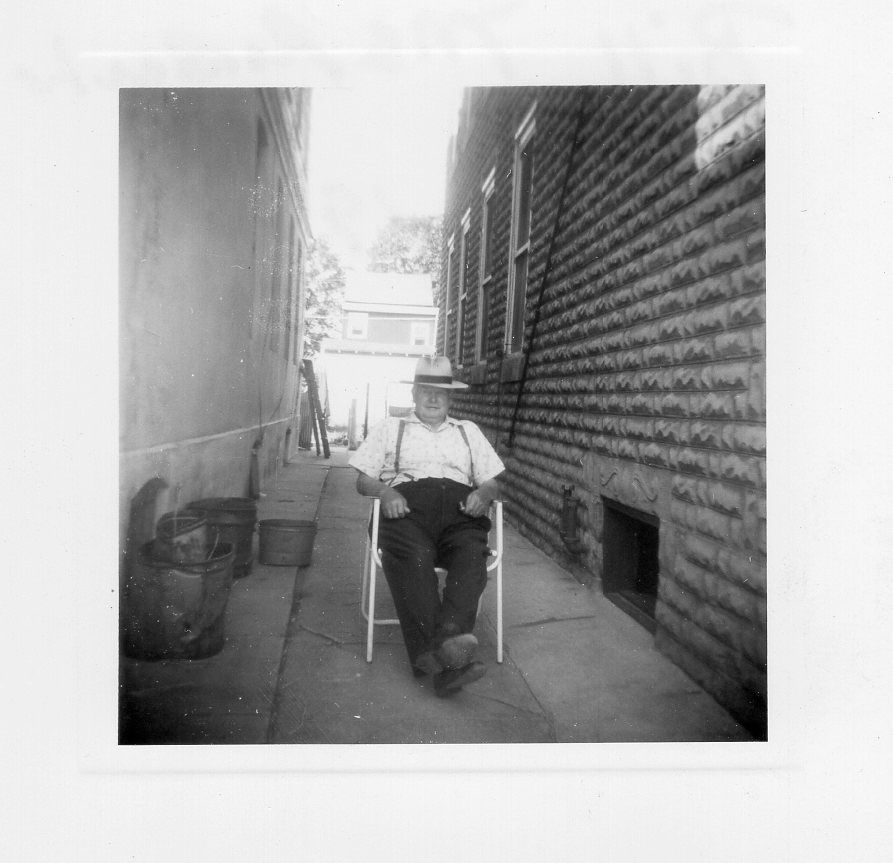 Vintage black and white photographs showing people seated in chairs along a brick wall exterior.