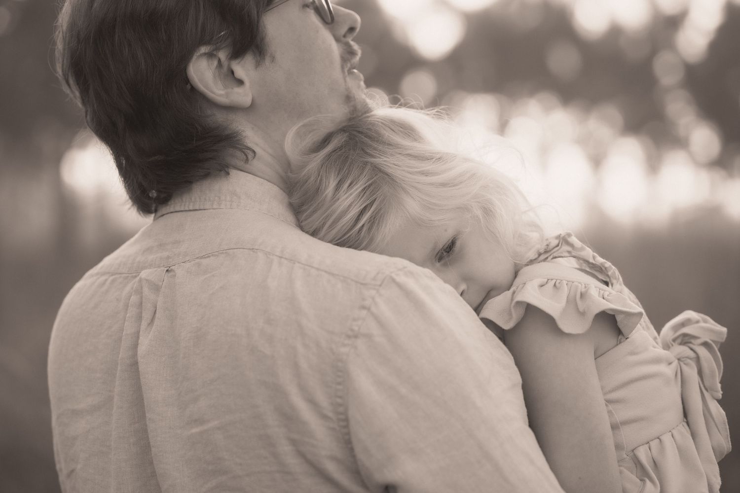 A romantic black and white wedding photo series showing tender moments between a couple during their special day.
