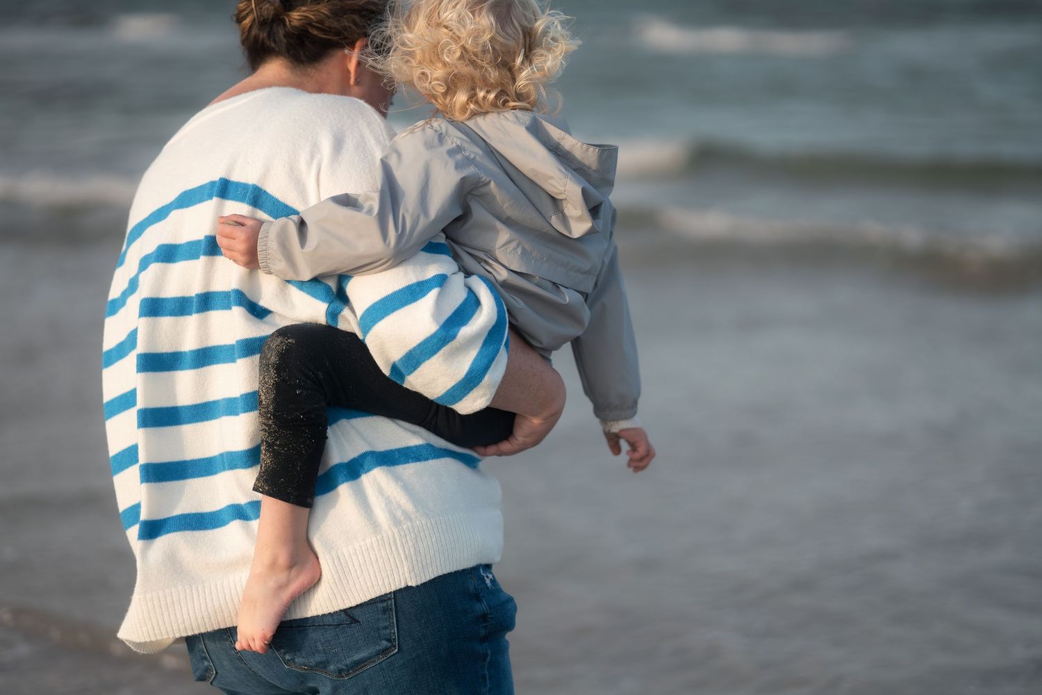 A series of candid moments captured at the beach with people enjoying the ocean waves and sandy shoreline.