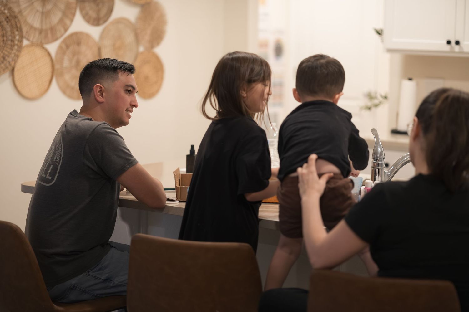 Group sitting together at a table during an evening activity.