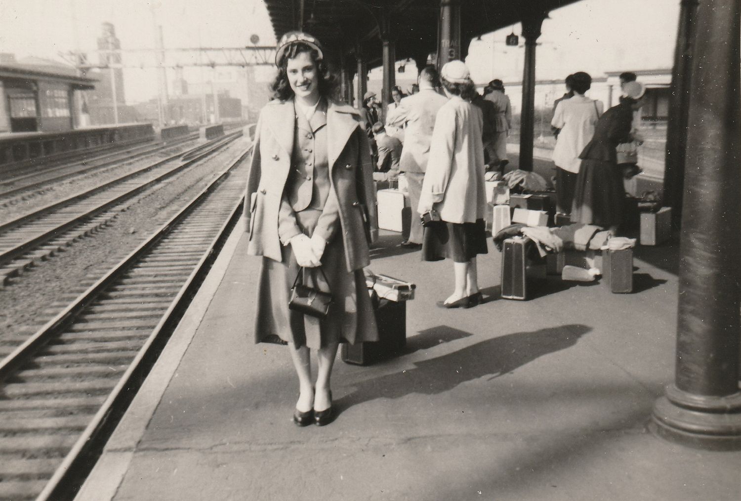Vintage black and white photos show people waiting on a train platform in the 1940s or 1950s.