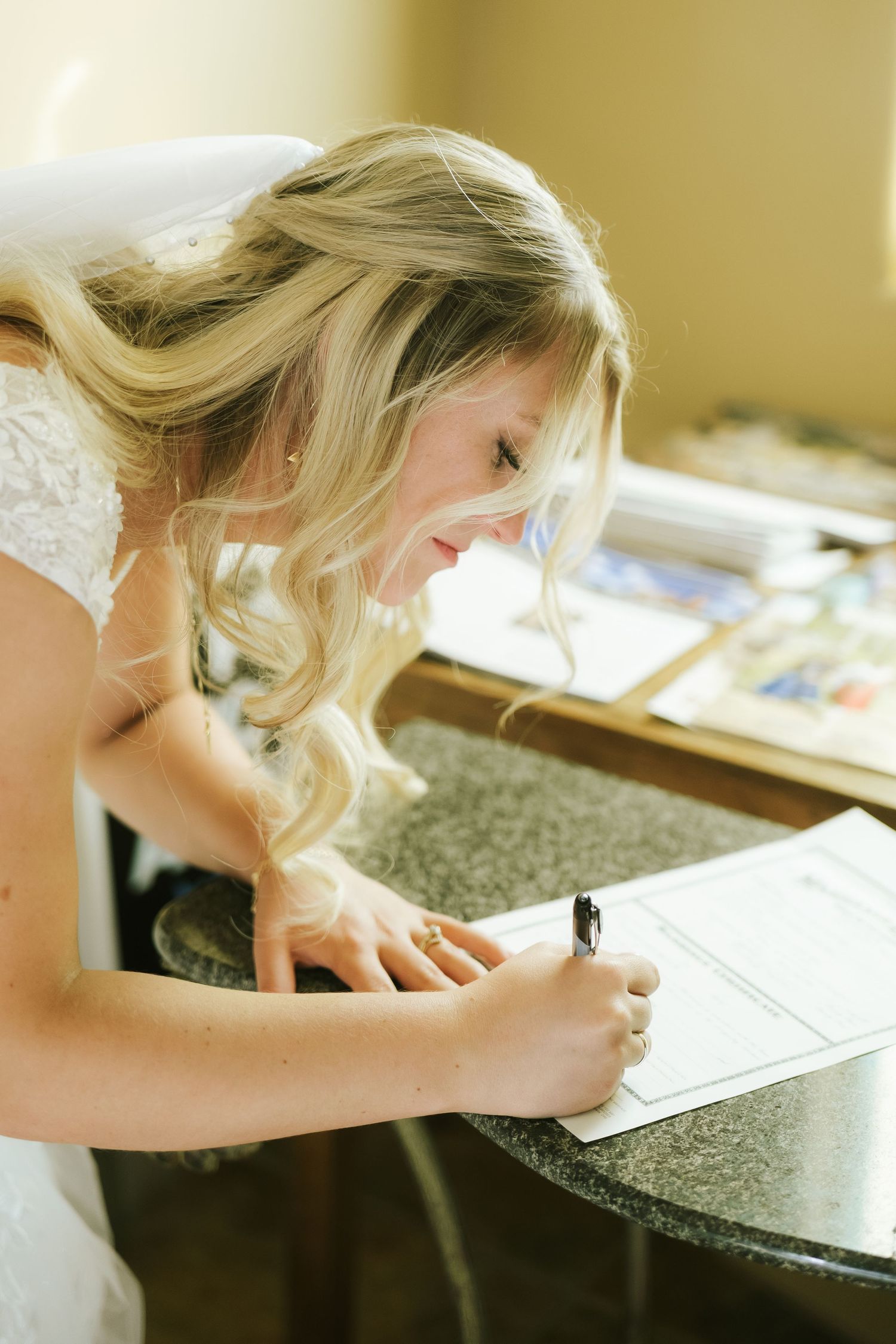 bride signing marriage certificate