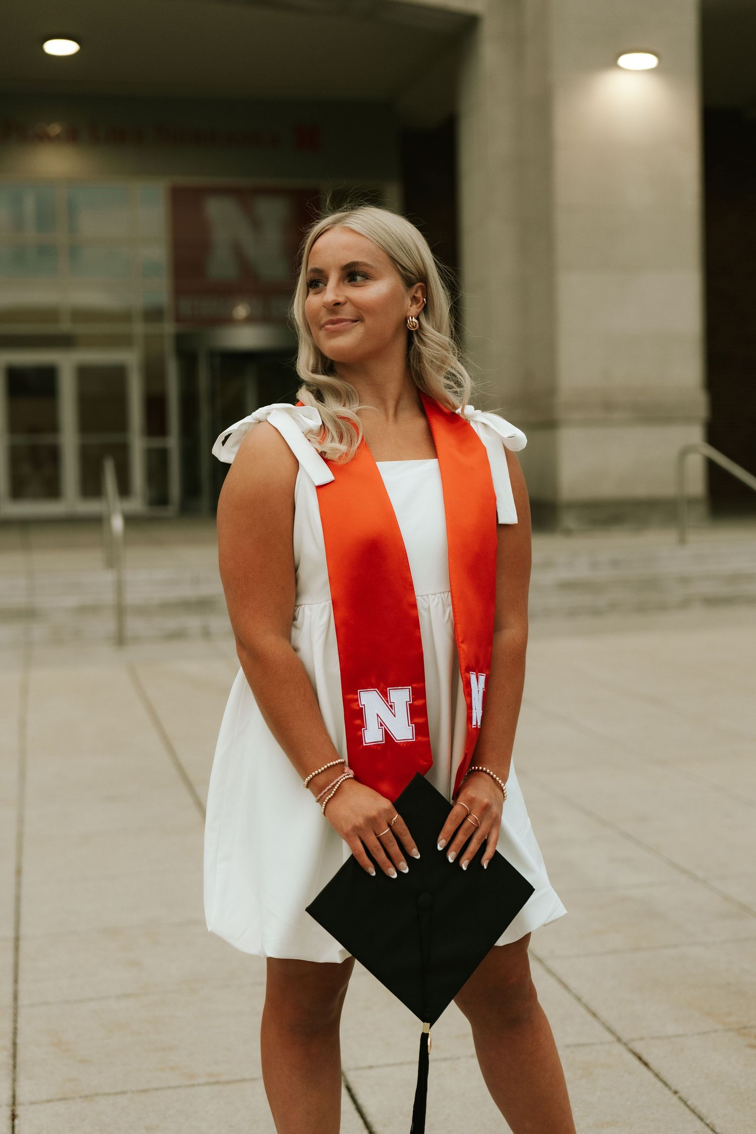 girl posing for university of lincoln nebraska grad photos