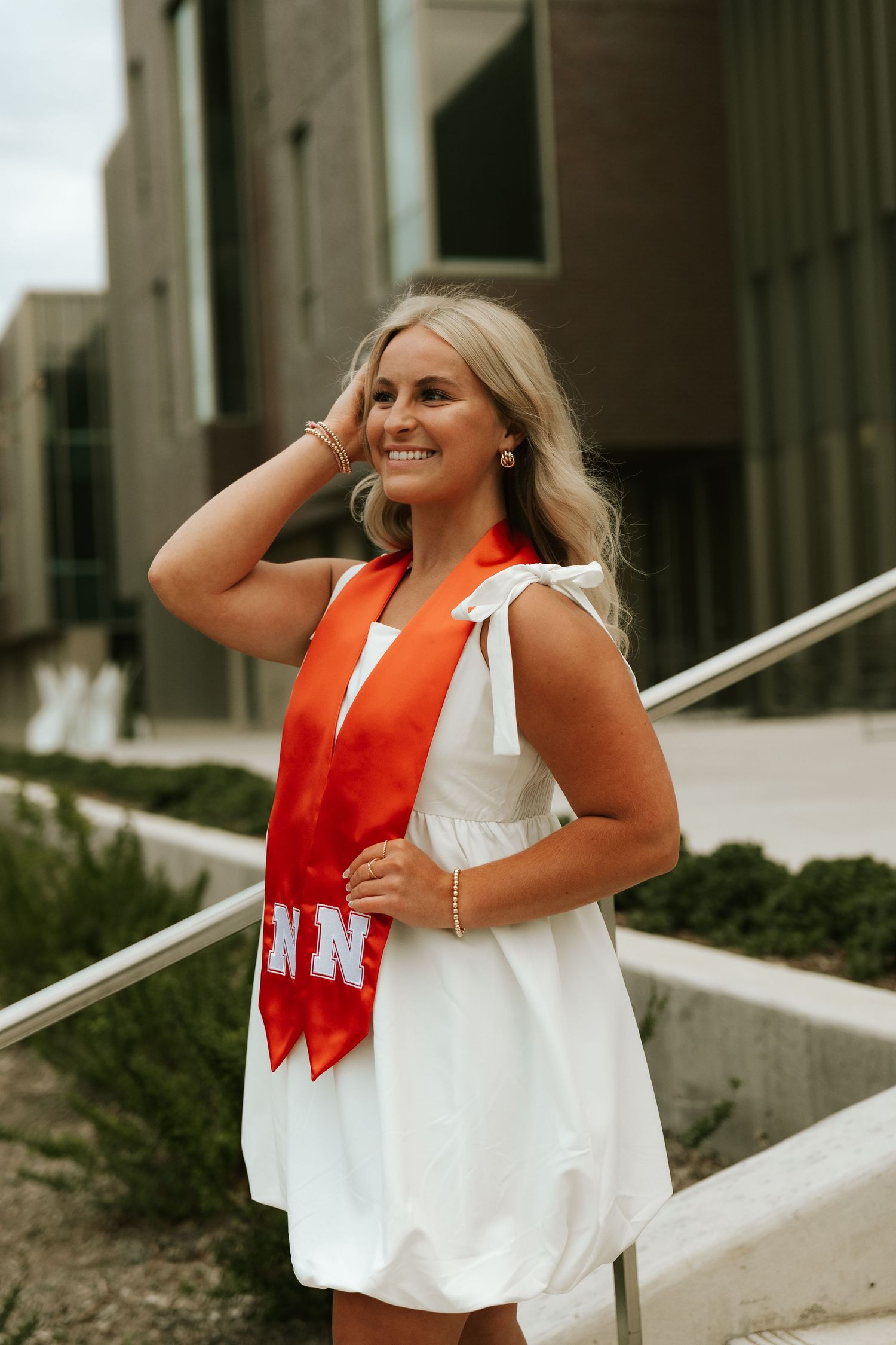 girl posing for university of lincoln nebraska grad photos