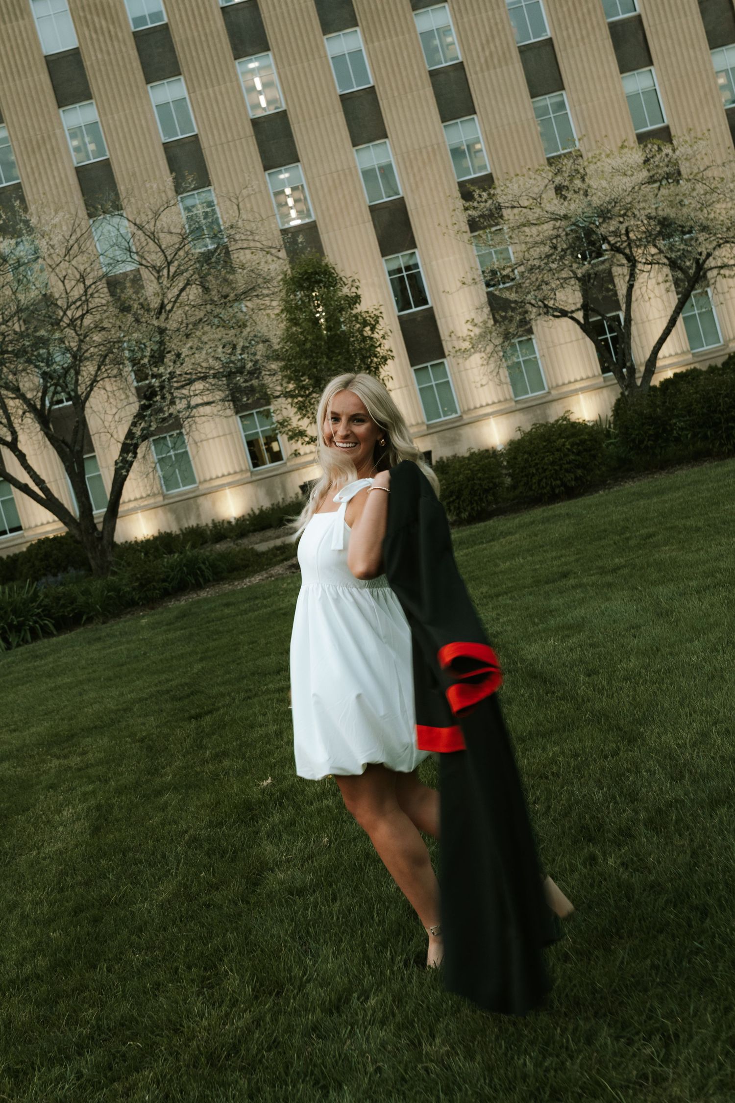 girl with gown for grad photos