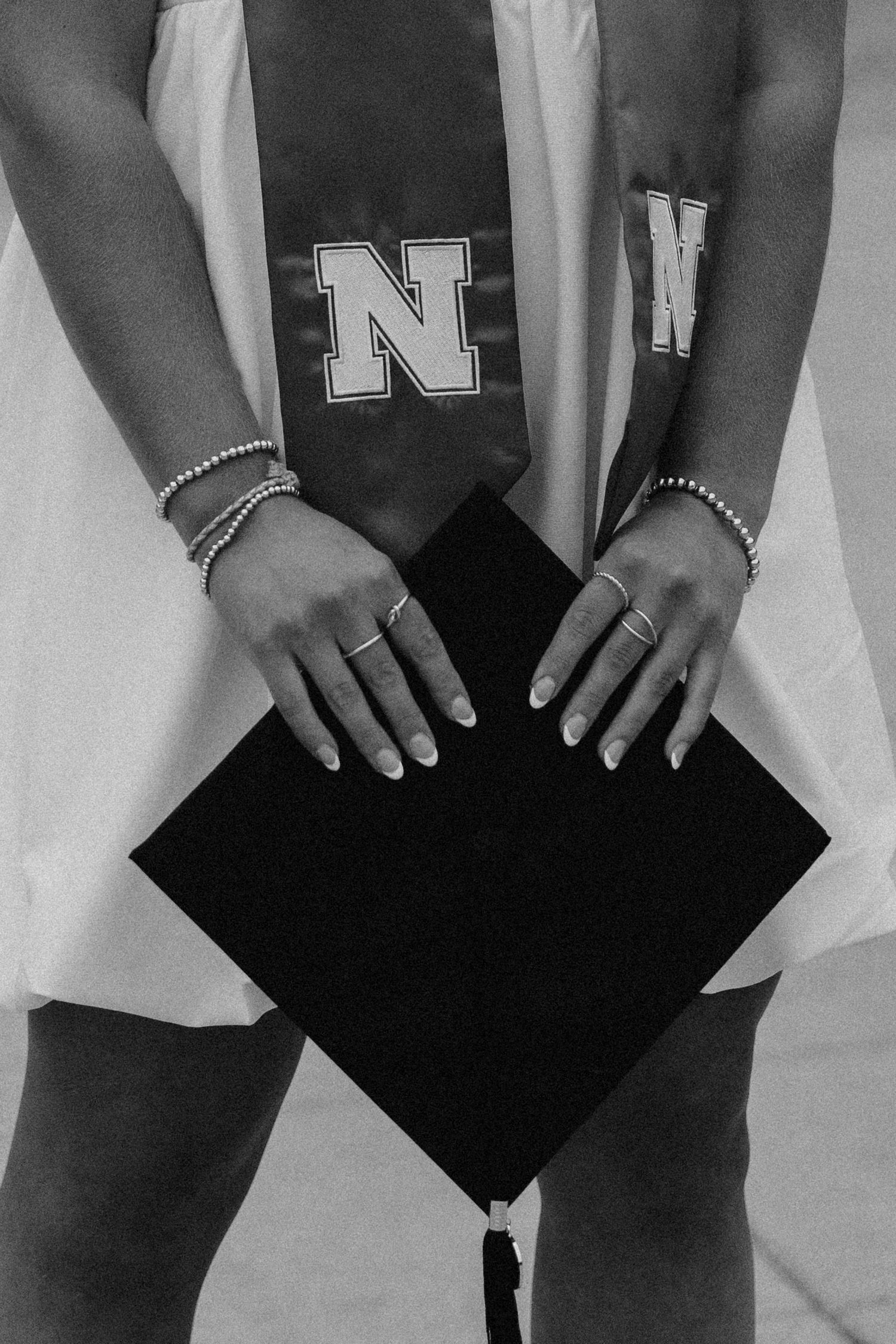 girl posing for university of lincoln nebraska grad photos