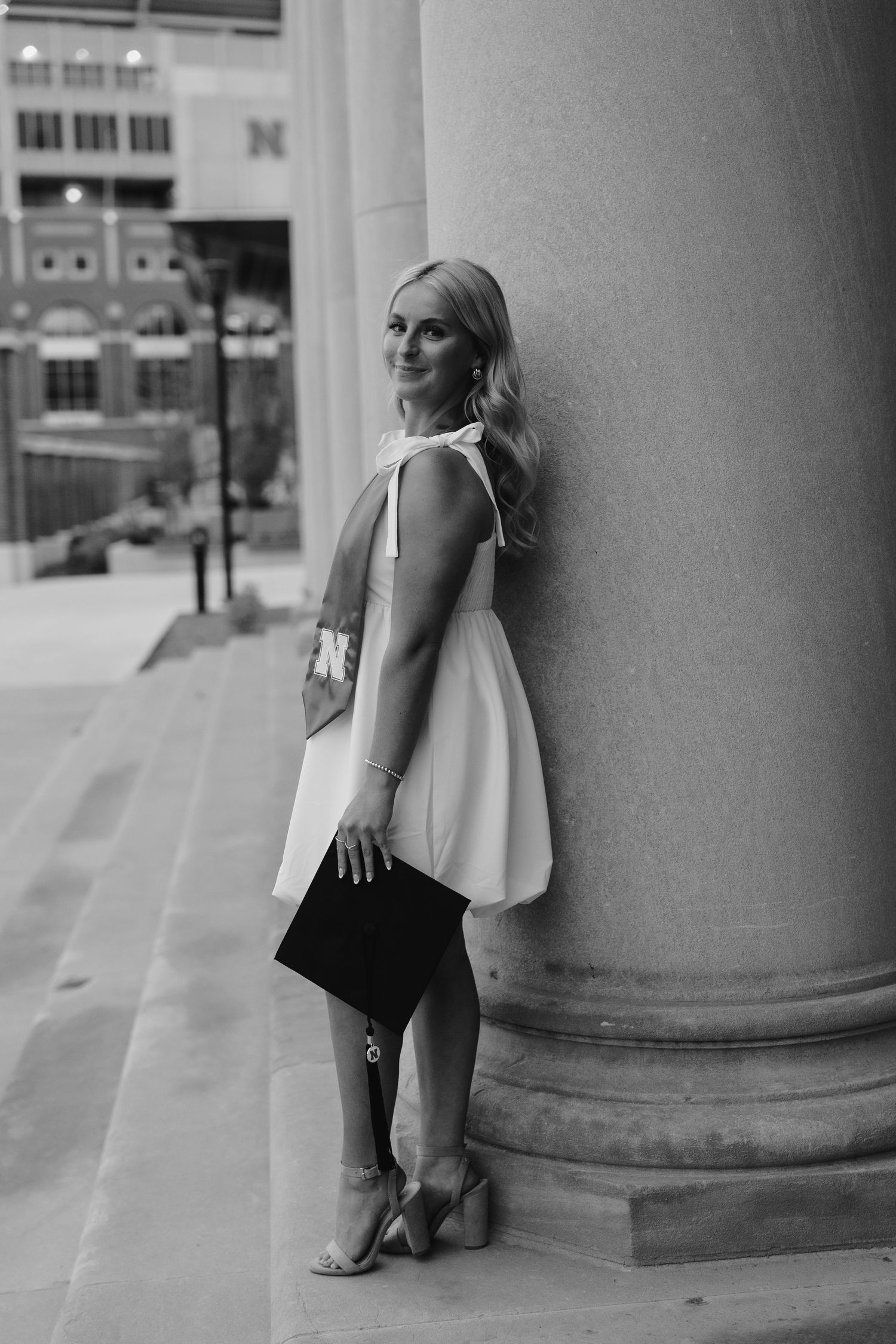 girl posing for university of lincoln nebraska grad photos