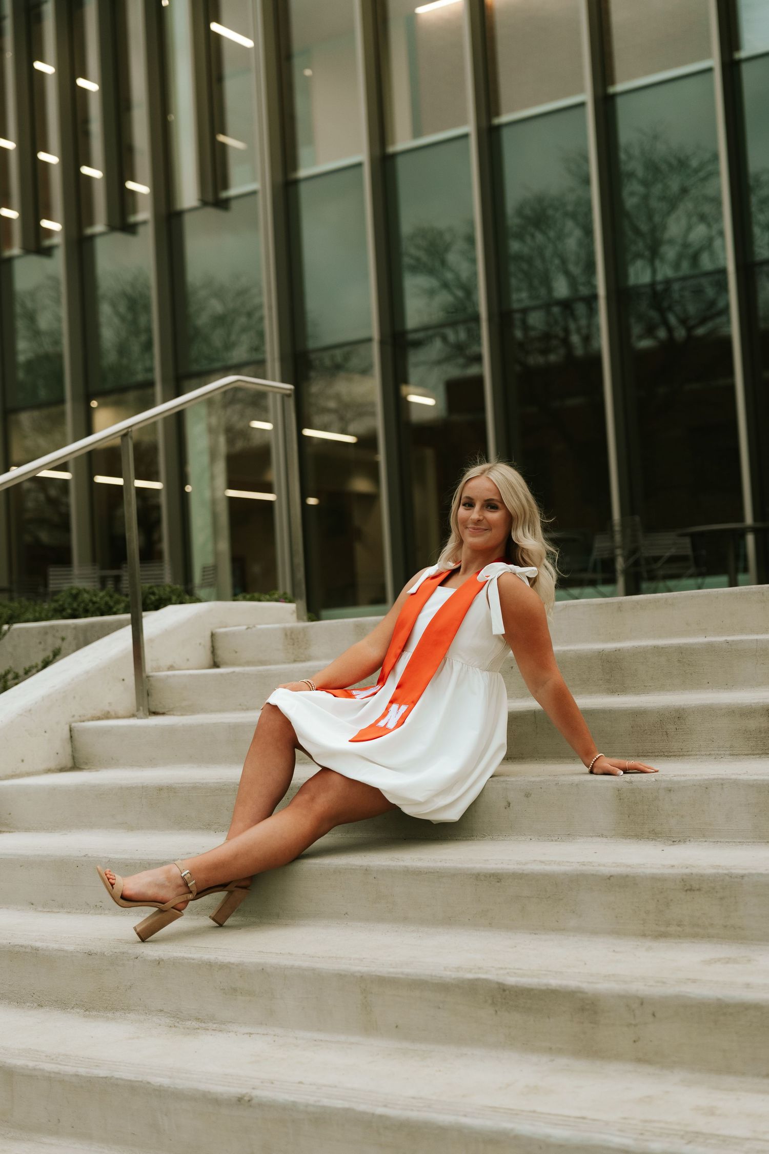girl posing for university of lincoln nebraska grad photos