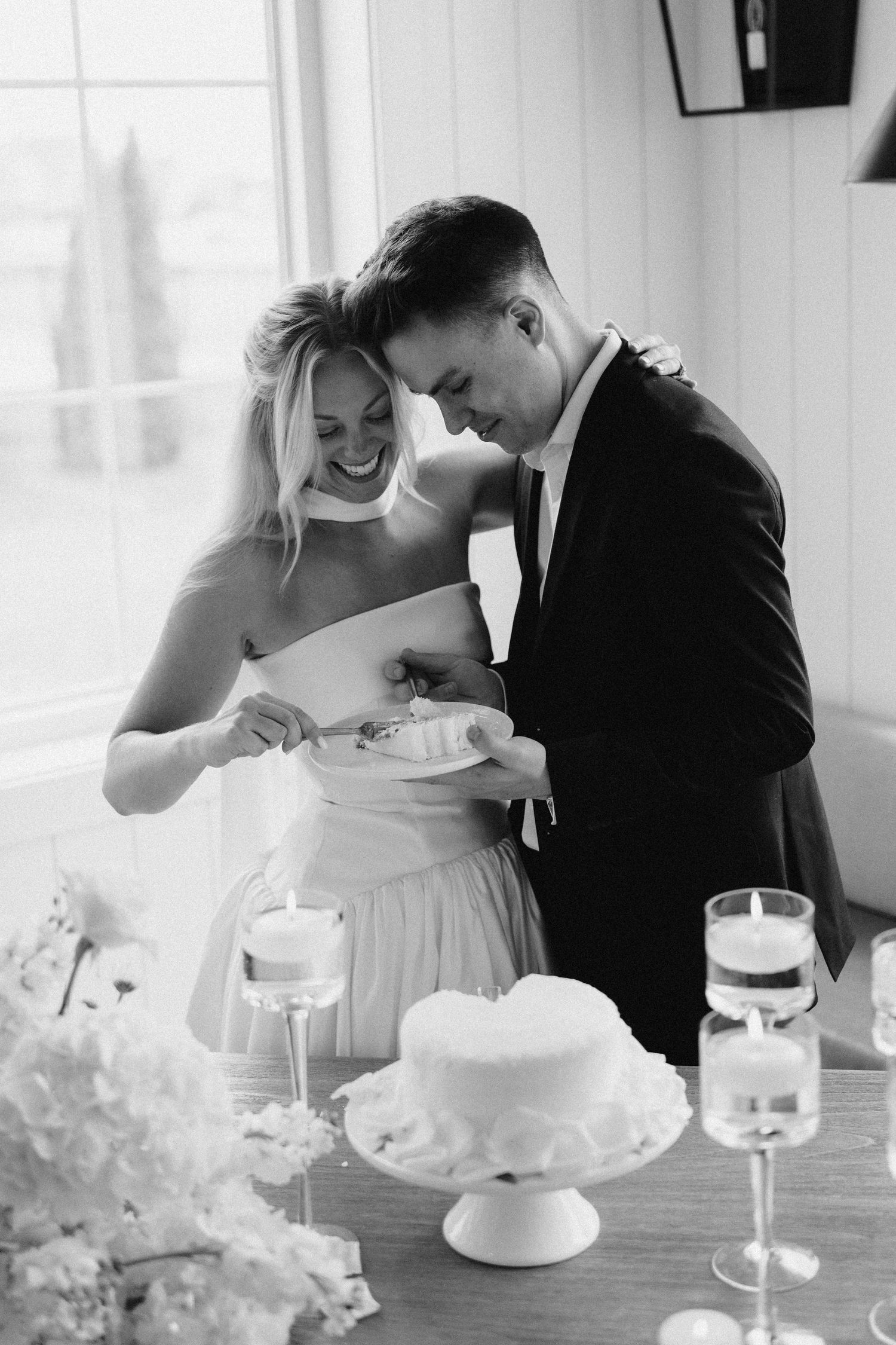 photo of bride and groom cutting cake