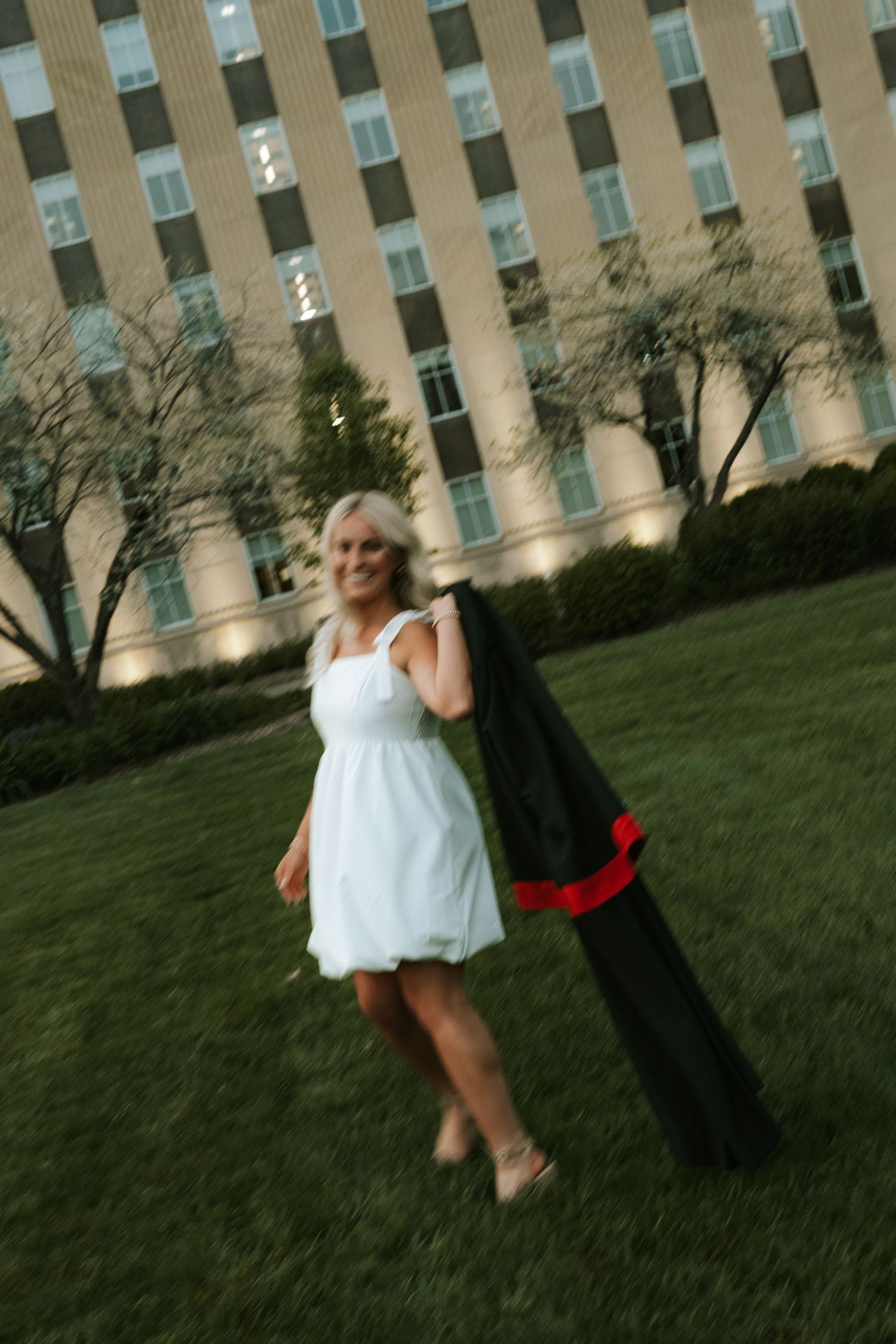 girl with gown for grad photos