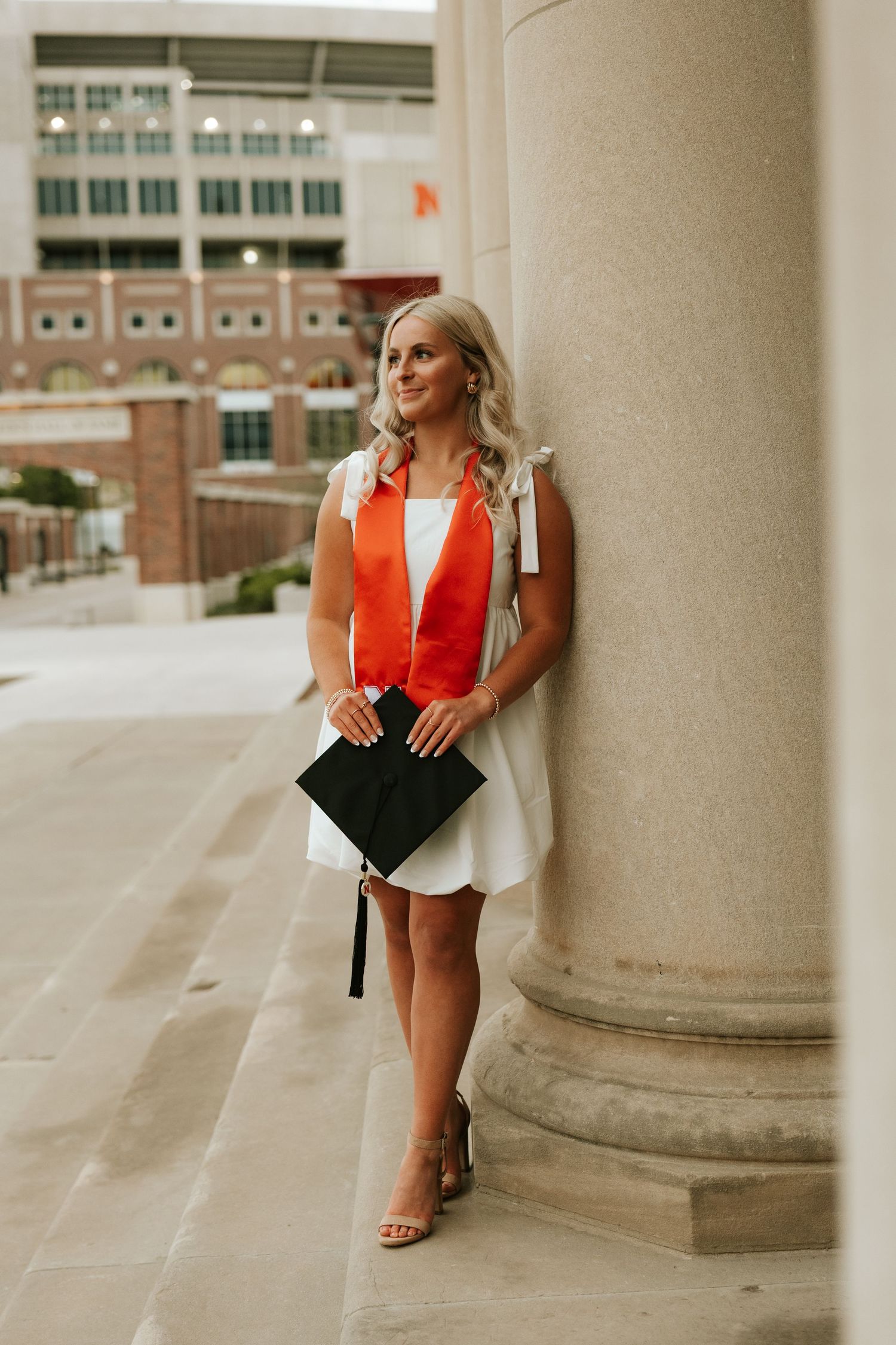 girl posing for university of lincoln nebraska grad photos