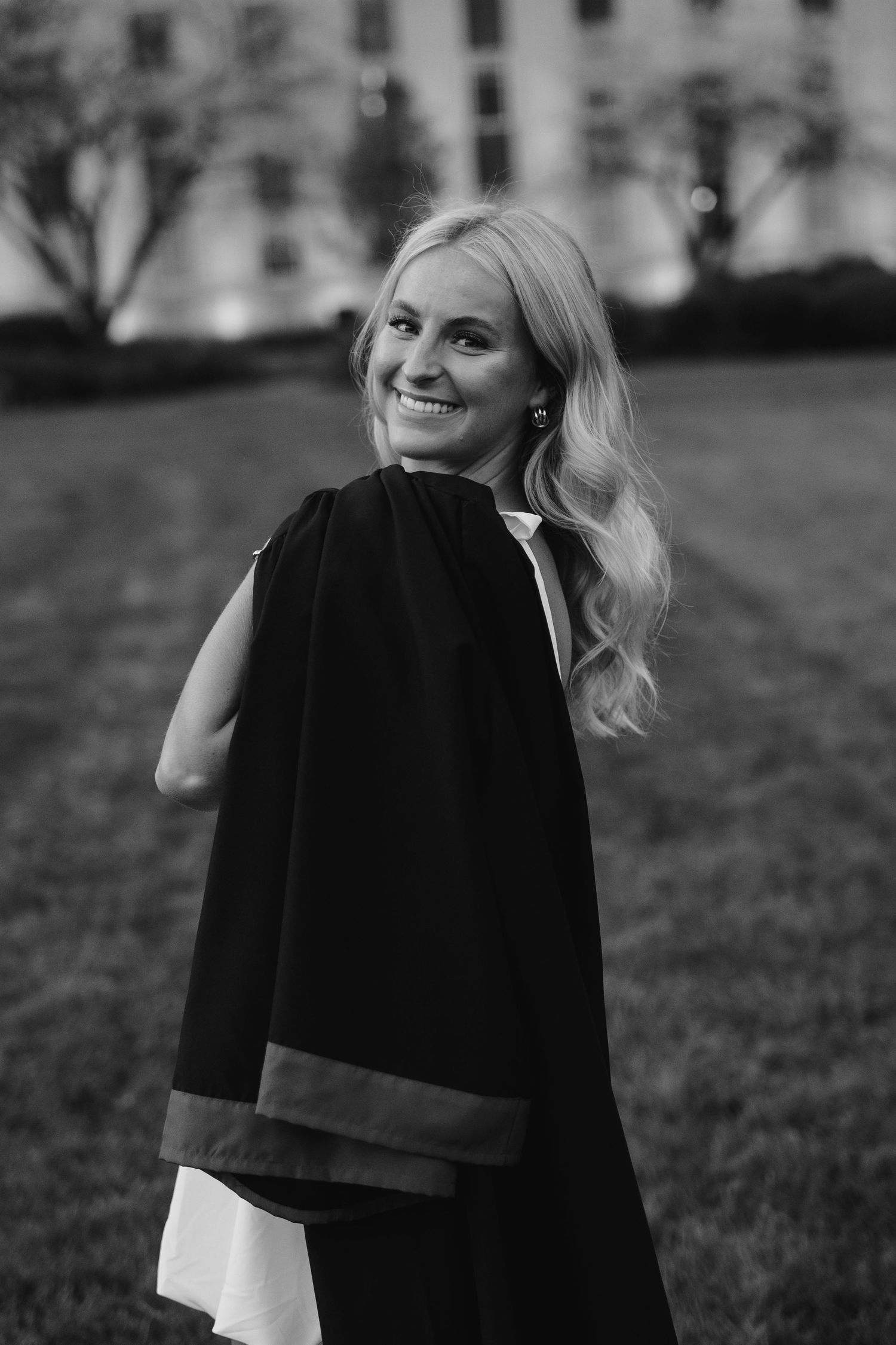 girl with gown for grad photos