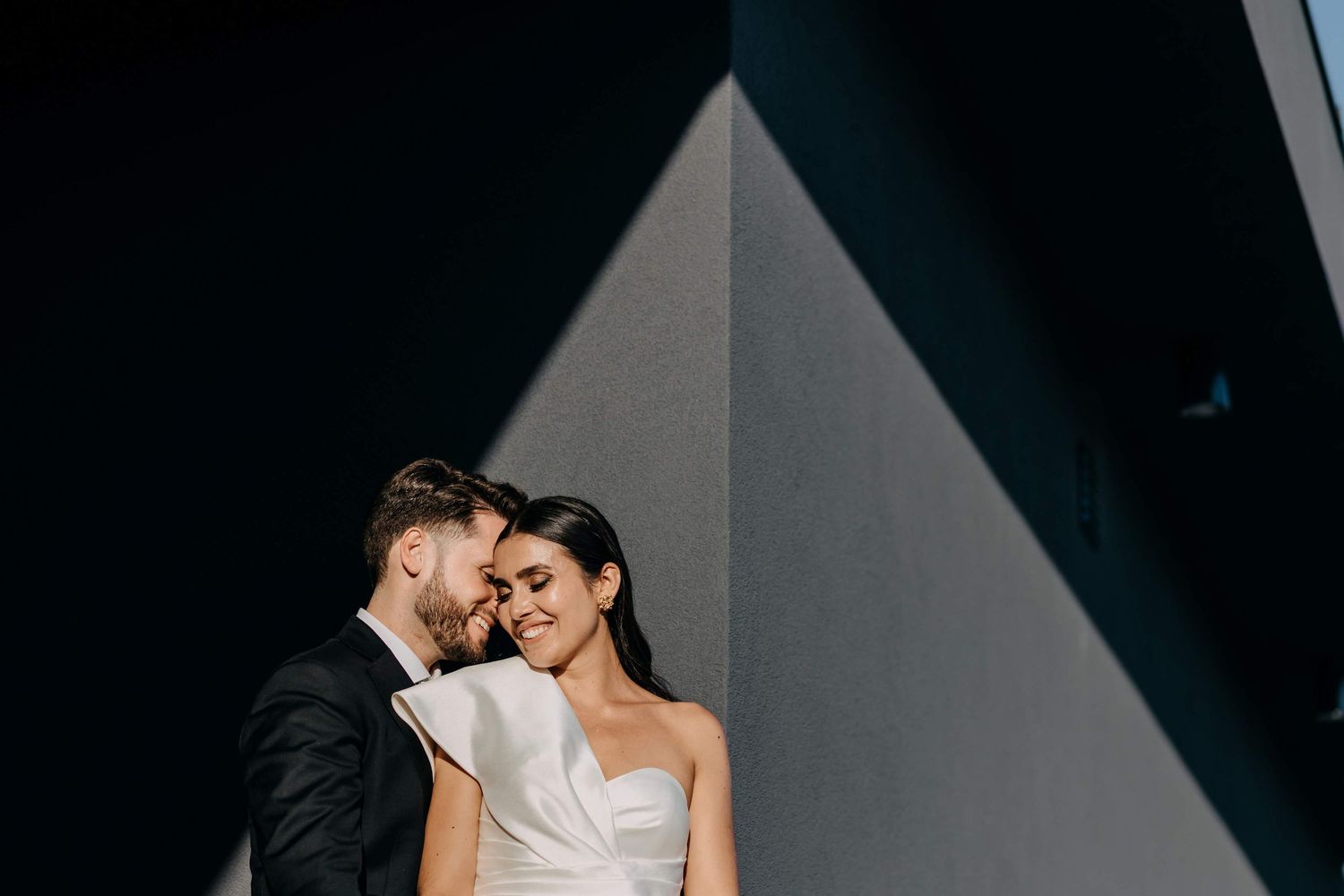 A romantic wedding photo series showing six intimate moments between newlyweds in black and white tones.