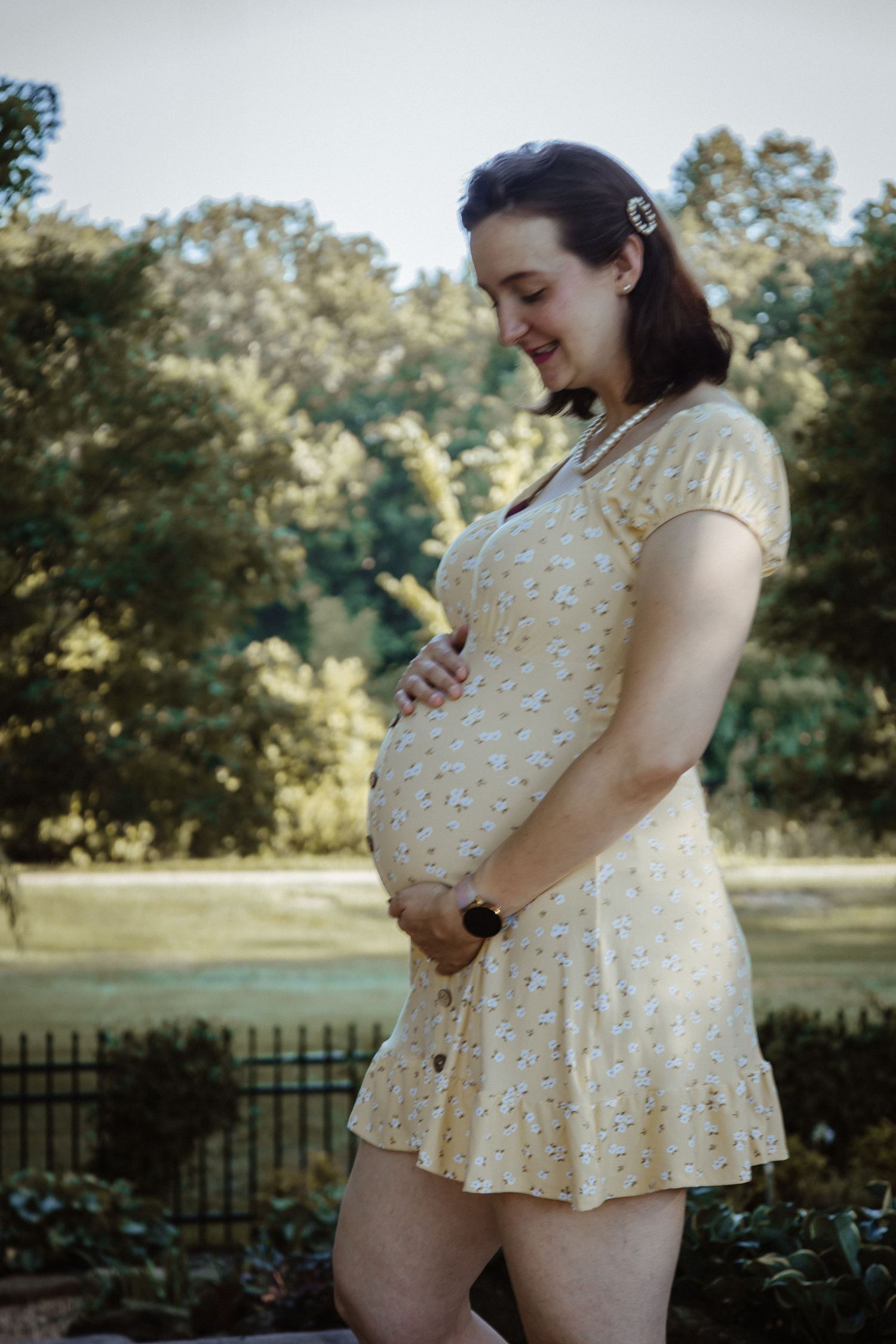 A series of maternity photos showing a person in a yellow polka dot dress posing in a sunny outdoor setting.