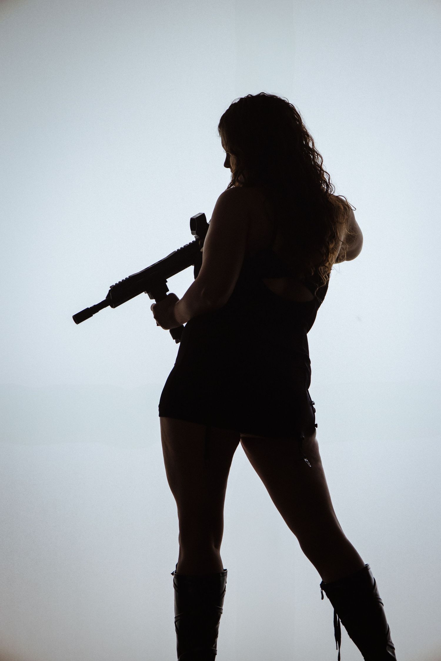 Silhouette sequence of a figure in dynamic poses against a light background, showing movement and expression.