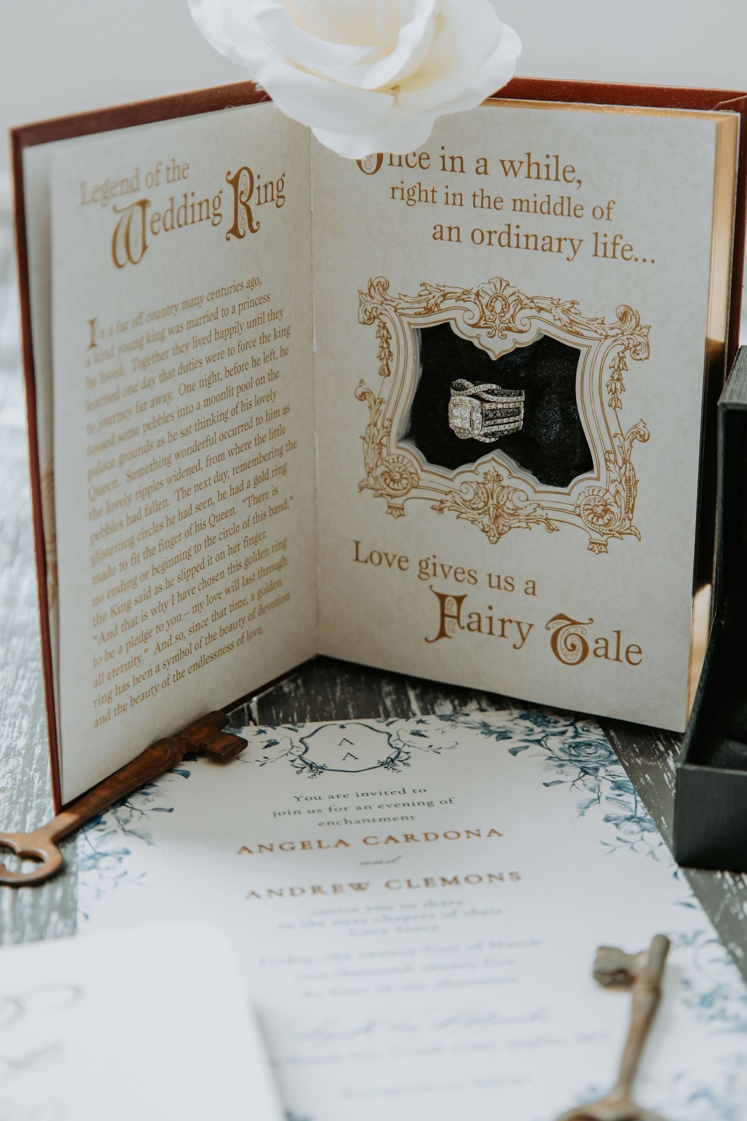 Fairy tale themed wedding book opened to display ornate text and decorative frame.