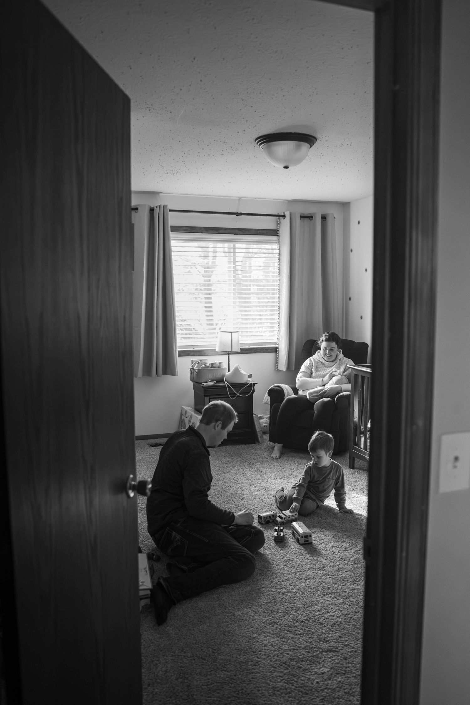 Black and white photo sequence showing a dark interior room with carpeted floor and window views from different angles.