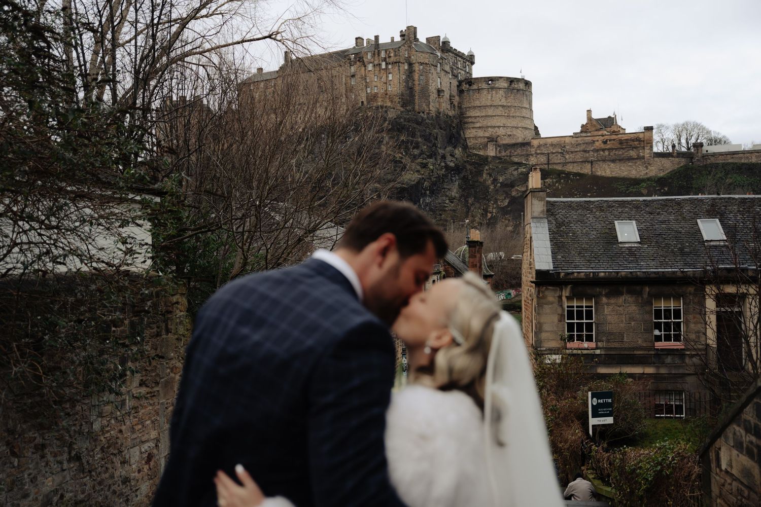 A series of romantic wedding photos showing couples embracing against the backdrop of Edinburgh's historic architecture.