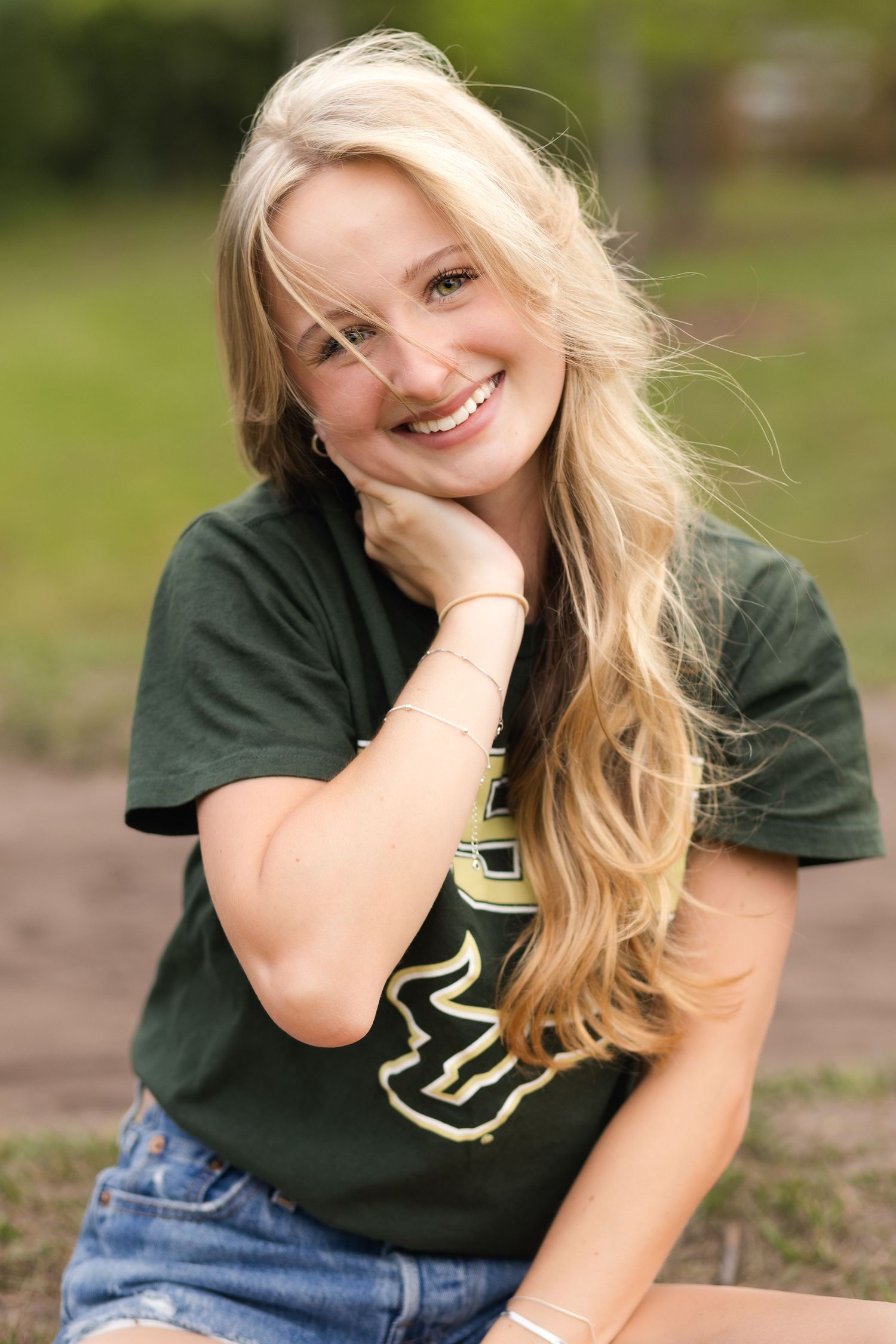 Senior portrait of a future USF student celebrating graduation in Jacksonville, Florida.
