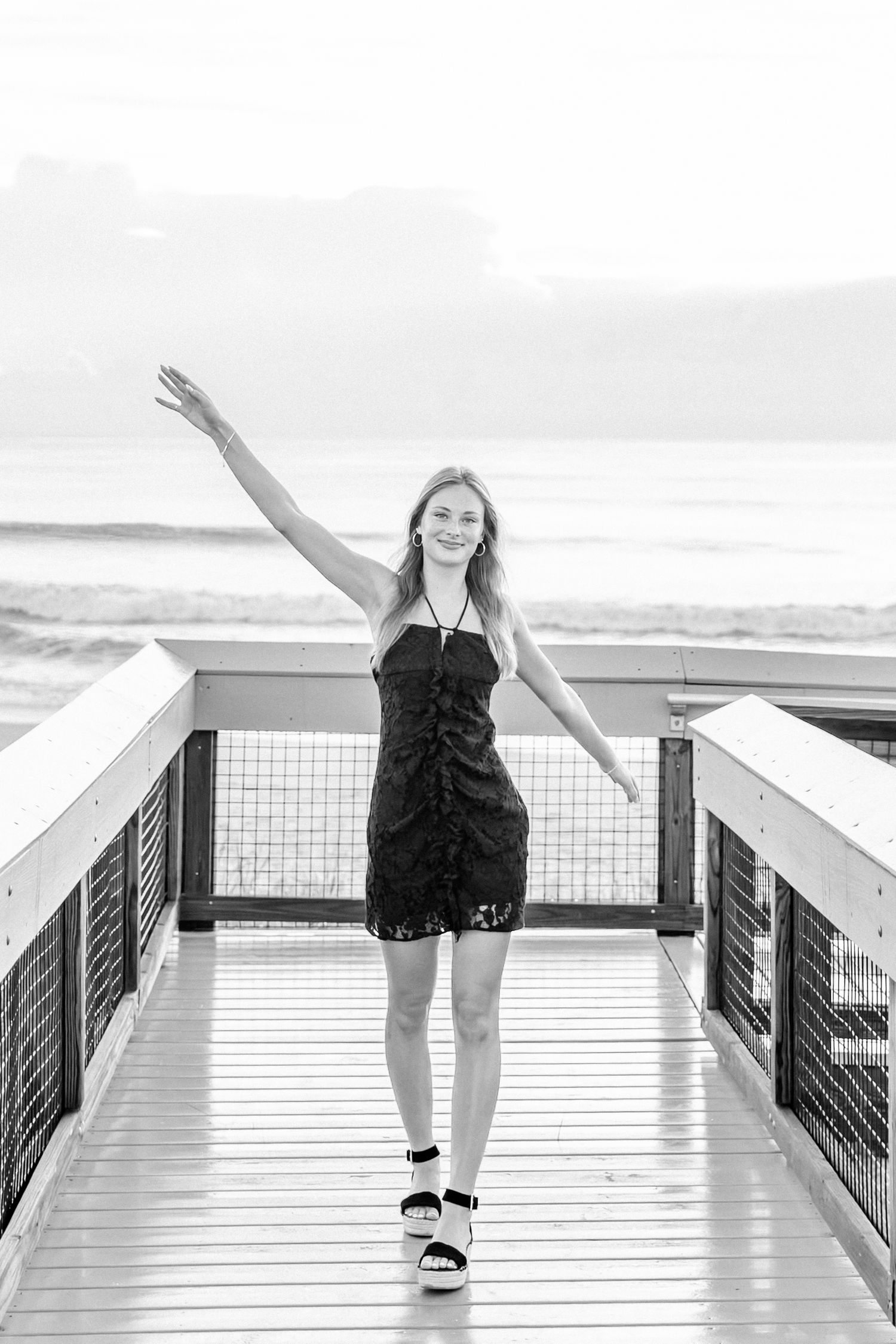 Senior girl celebrating senior year on beach in Ponte Vedra.