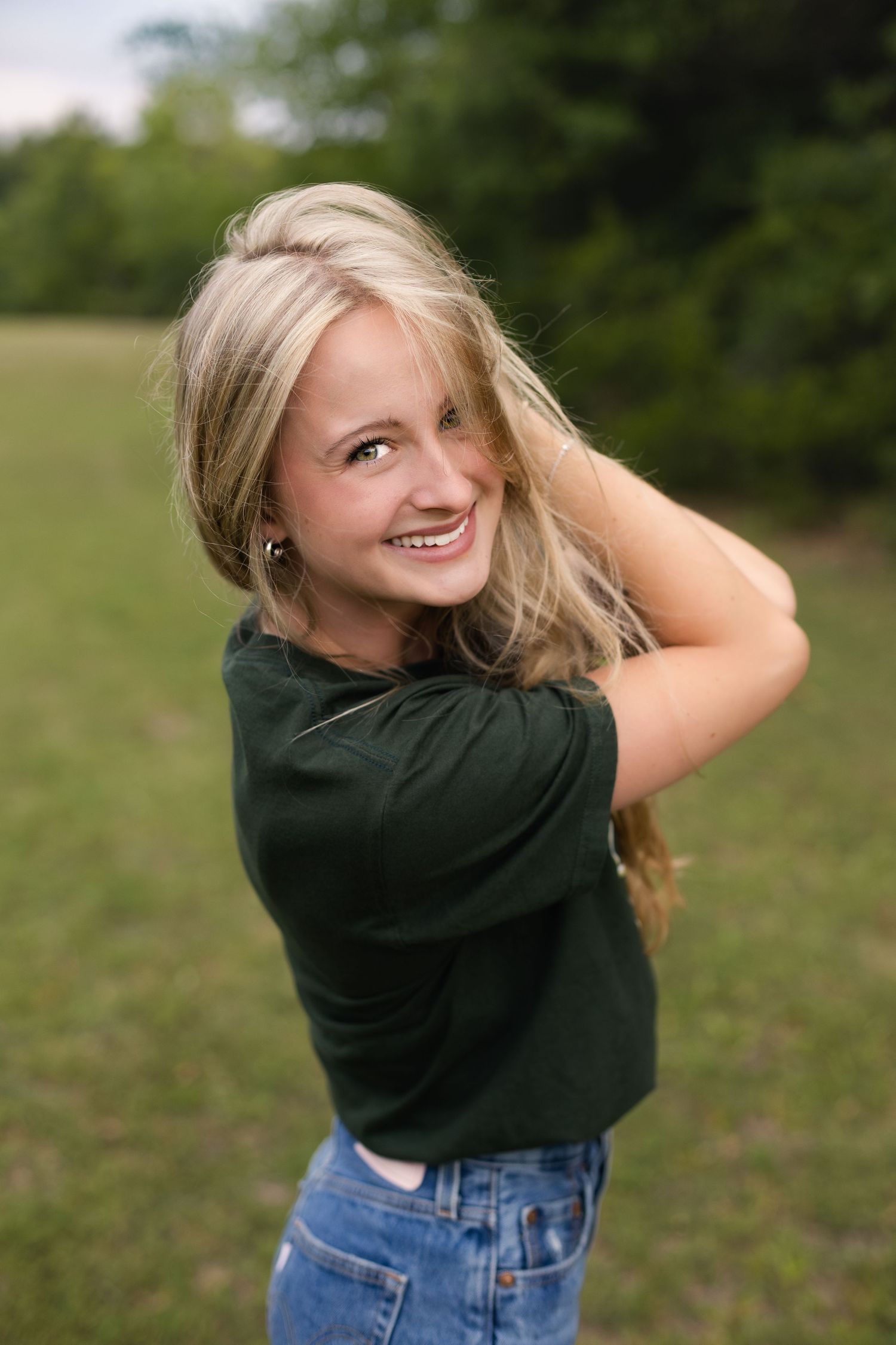 Senior girl laughing during her spring senior photo session in Jacksonville, Florida.