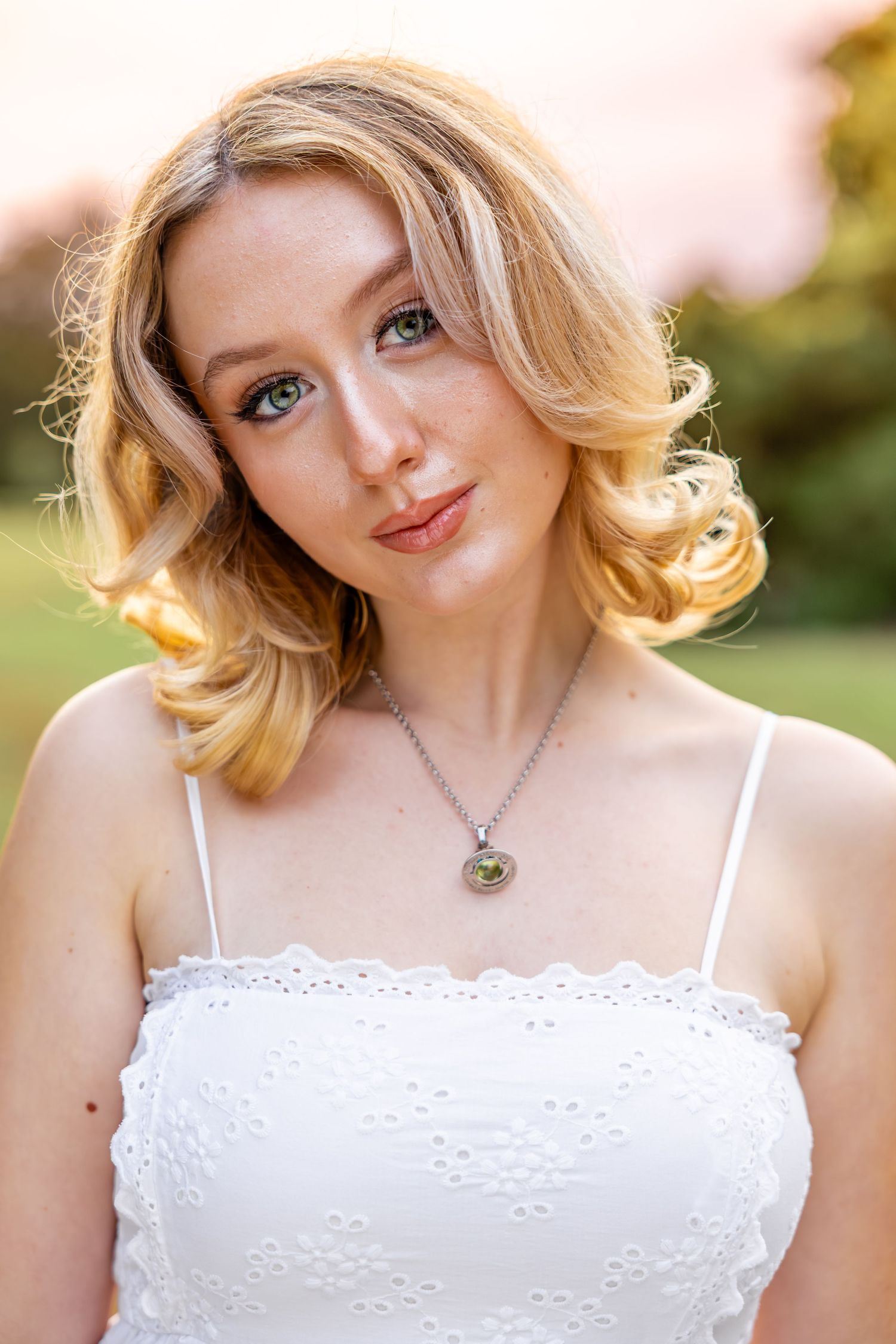 Senior girl portrait session in Camp Milton Historic Preserve field.