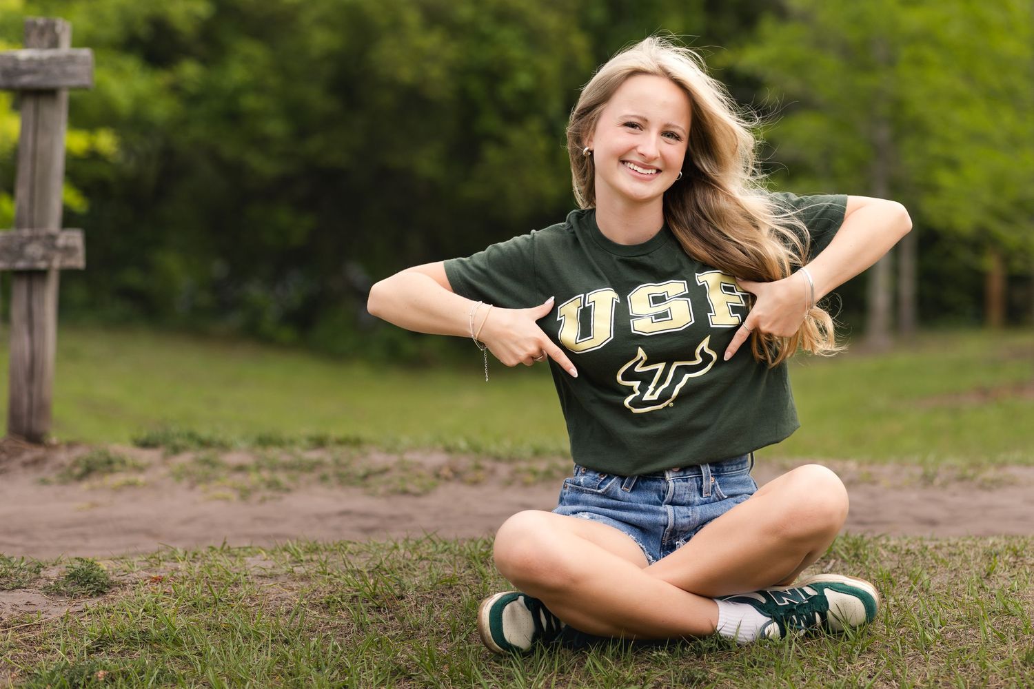 High school senior wearing a University of South Florida shirt during her Jacksonville senior portraits.