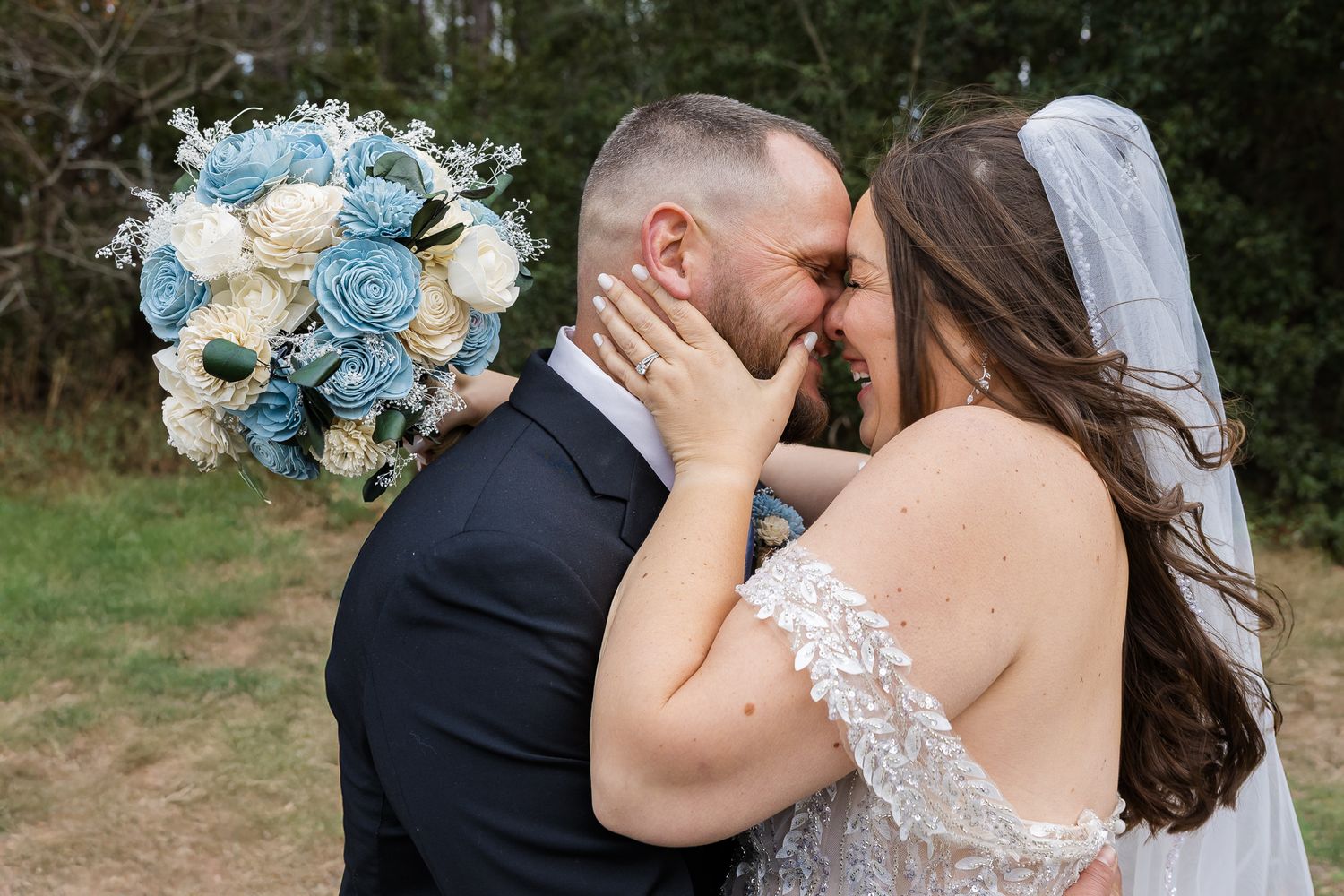 Bride and groom share an intimate forehead touch right before it snowed in Brunswick, GA.