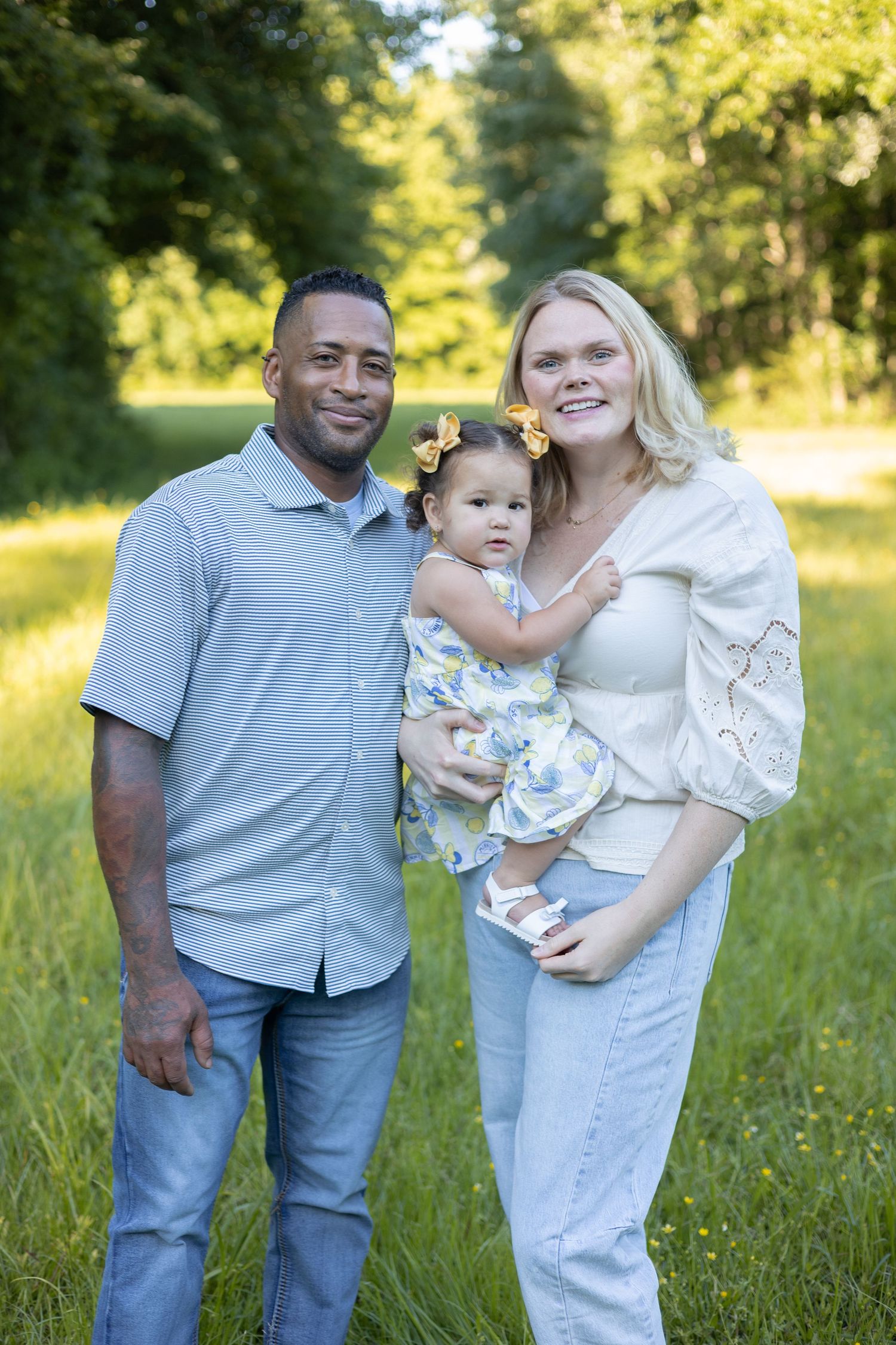 Family of three posing together outdoors, Huntsville Alabama family session