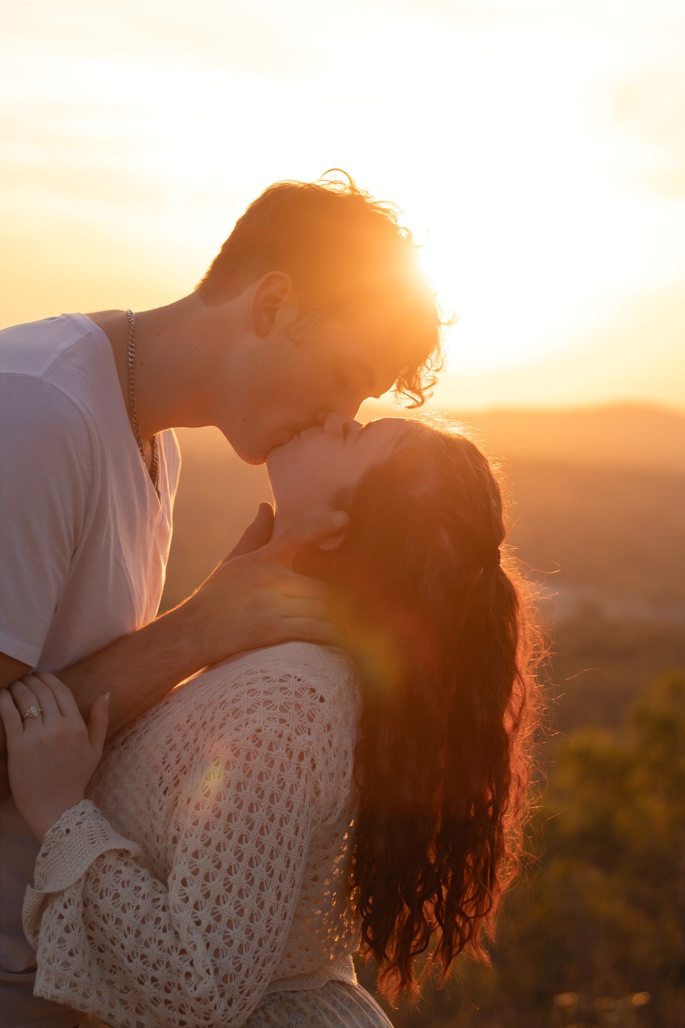Couple embracing at golden hour sunset, Huntsville Alabama engagement session