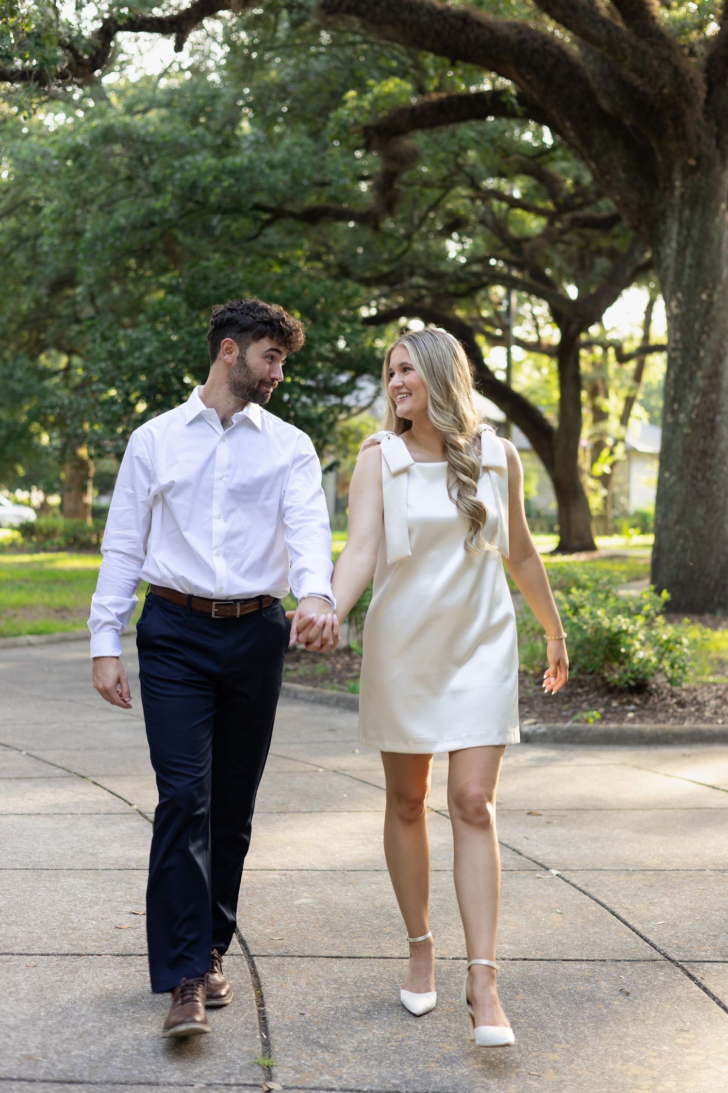 Engaged couple walking together during a natural lifestyle photography session
