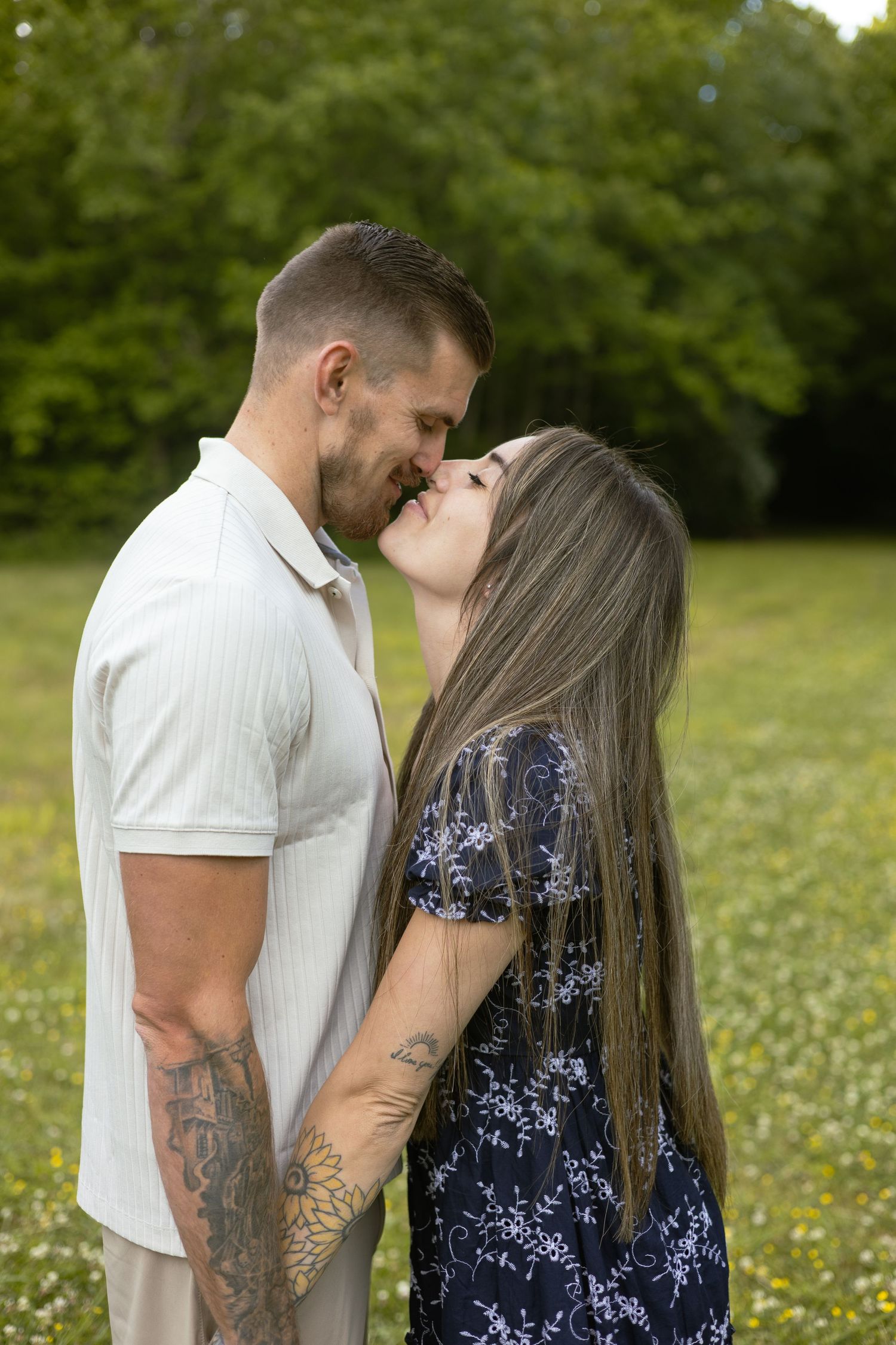 Couple standing close together outdoors, Huntsville Alabama engagement photographer