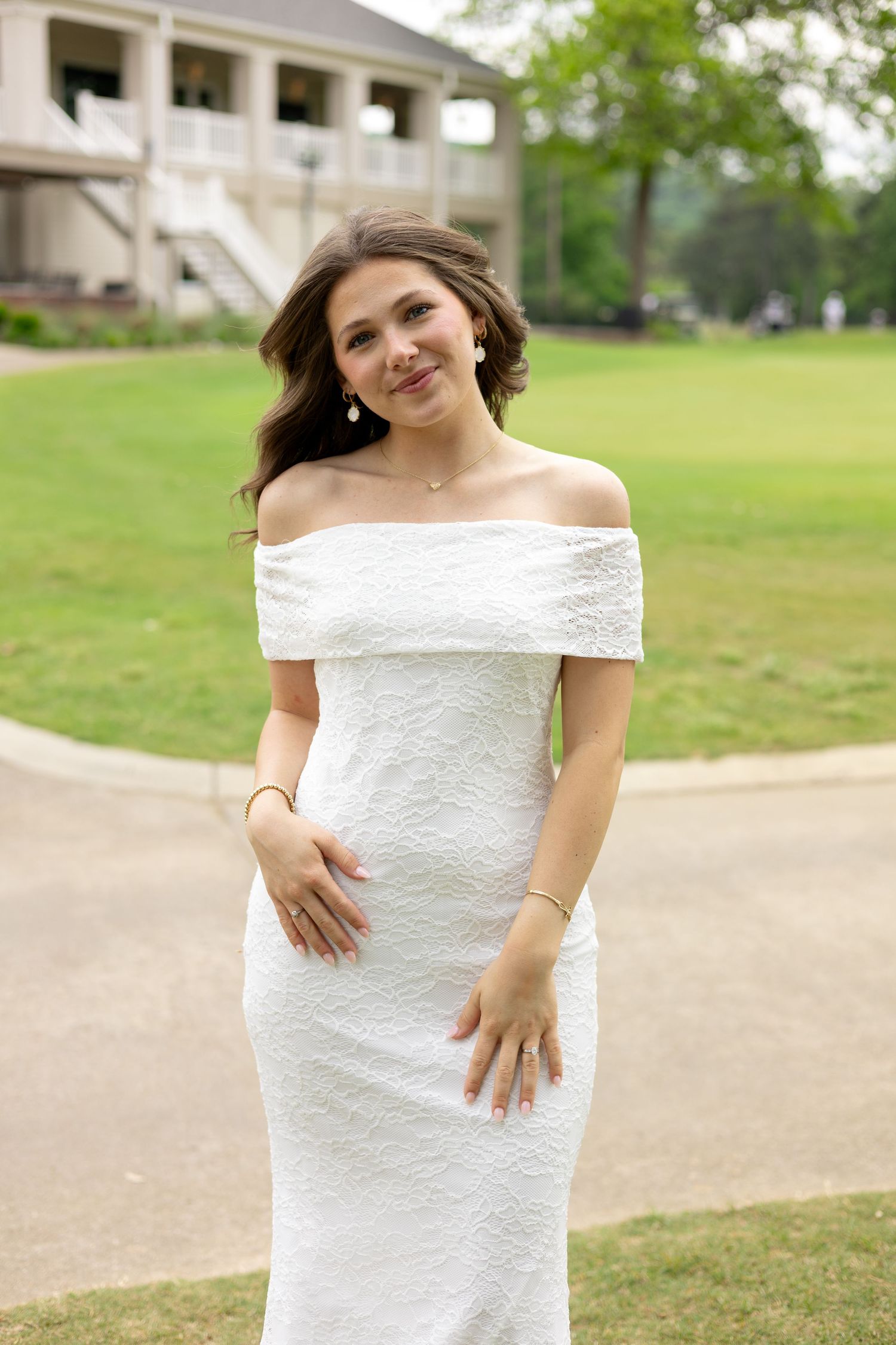 Woman in a white dress posing outdoors, Huntsville Alabama individual portrait session