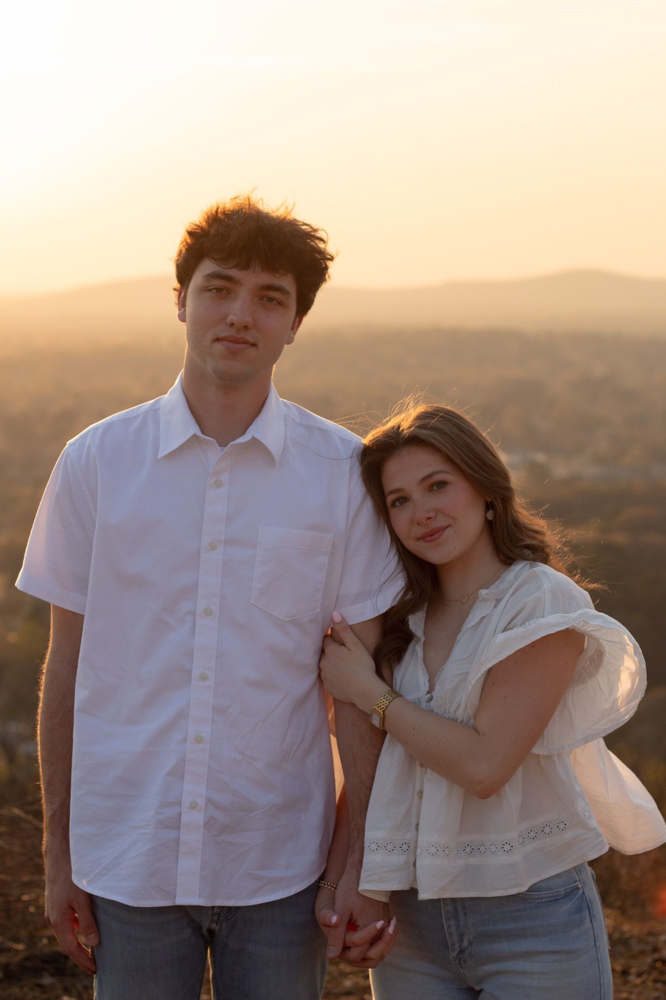 Couple standing together outdoors at golden hour, Huntsville Alabama engagement session