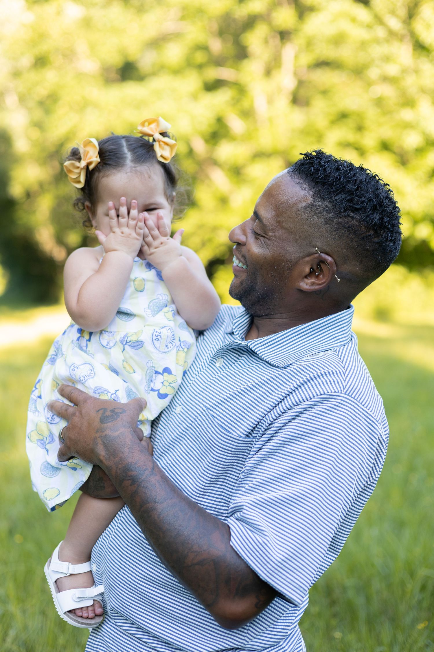 Father holding his young daughter outdoors, Huntsville Alabama family session