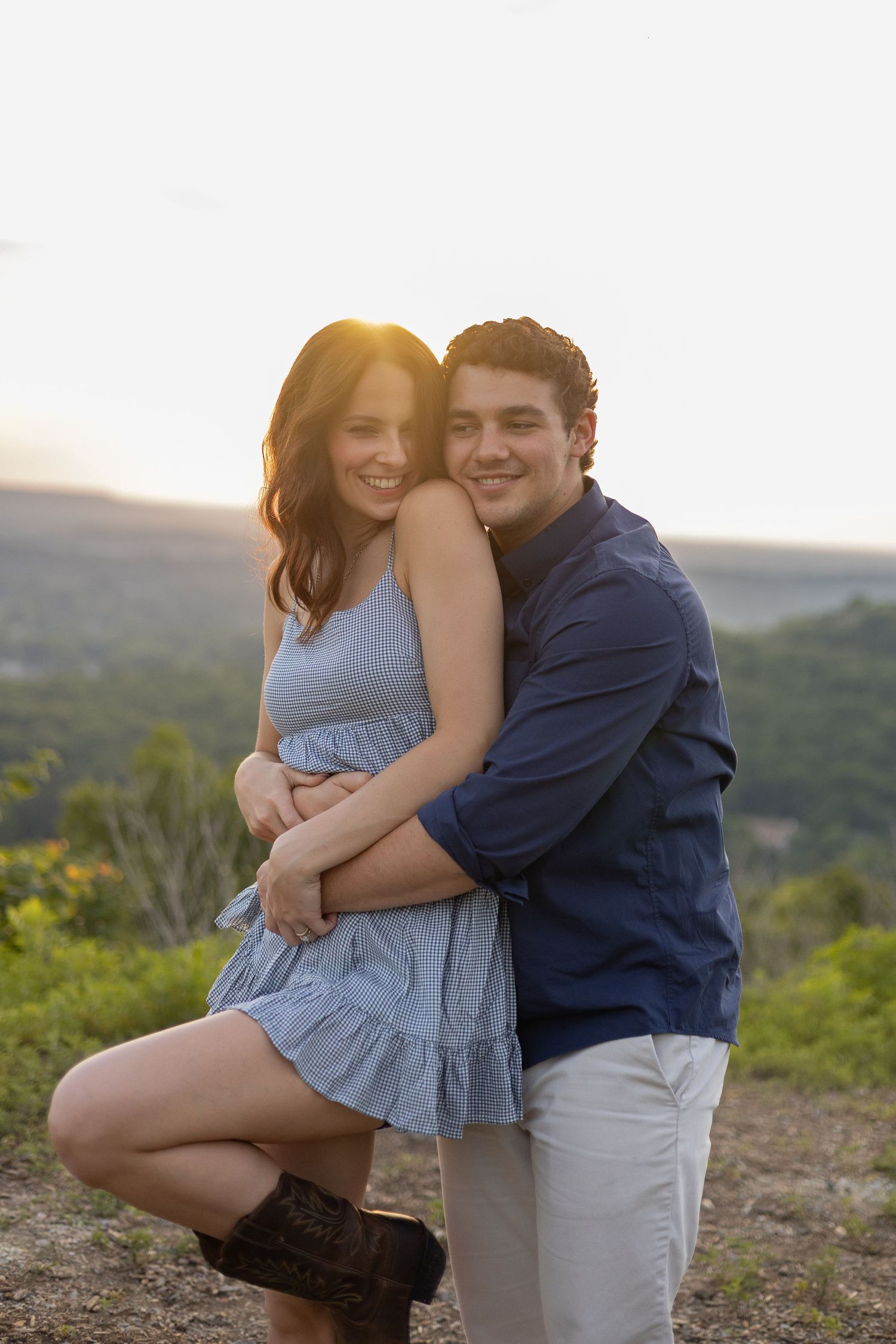 Couple embracing on a mountain overlook at sunset, Huntsville Alabama engagement session
